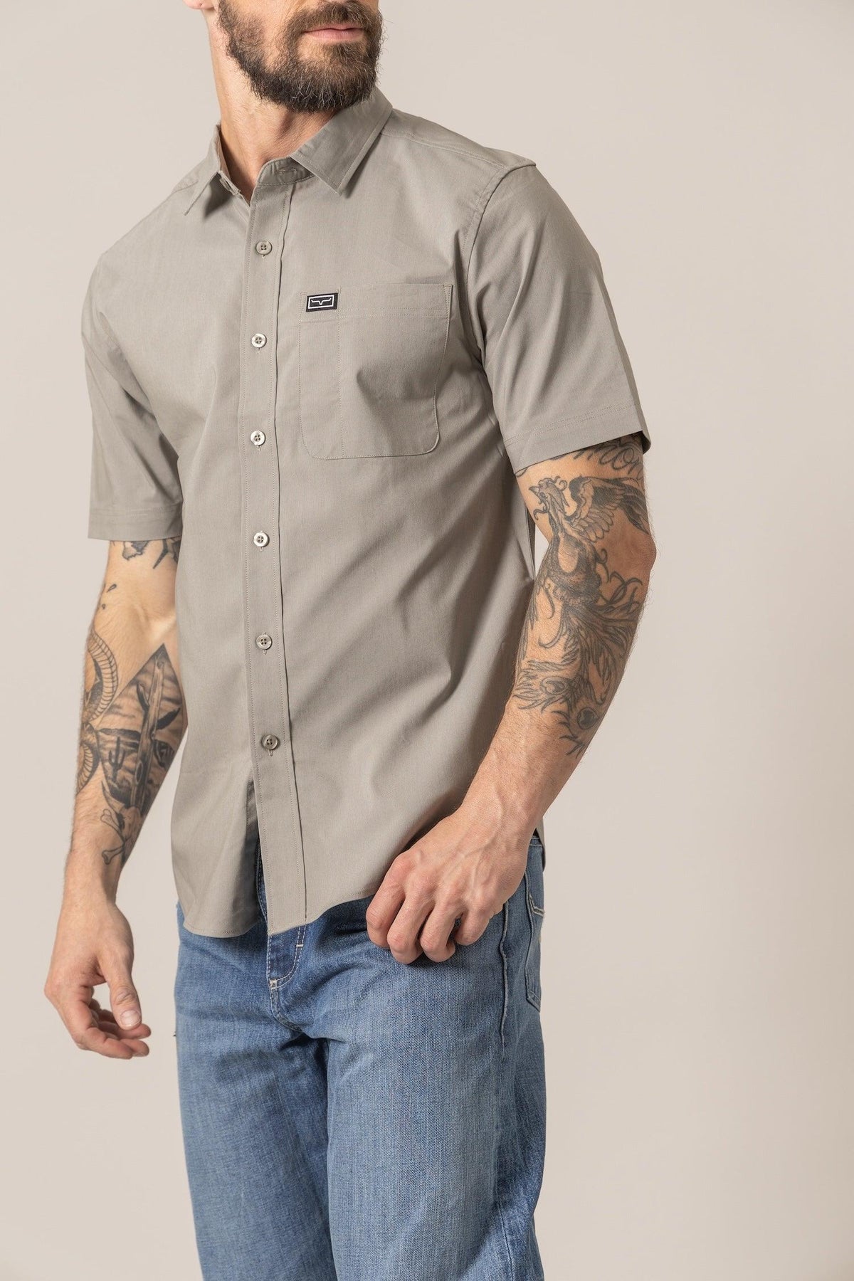 Kimes Ranch Linville Short Sleeve Dress Shirt in Sage, side view, with a chest pocket and logo patch