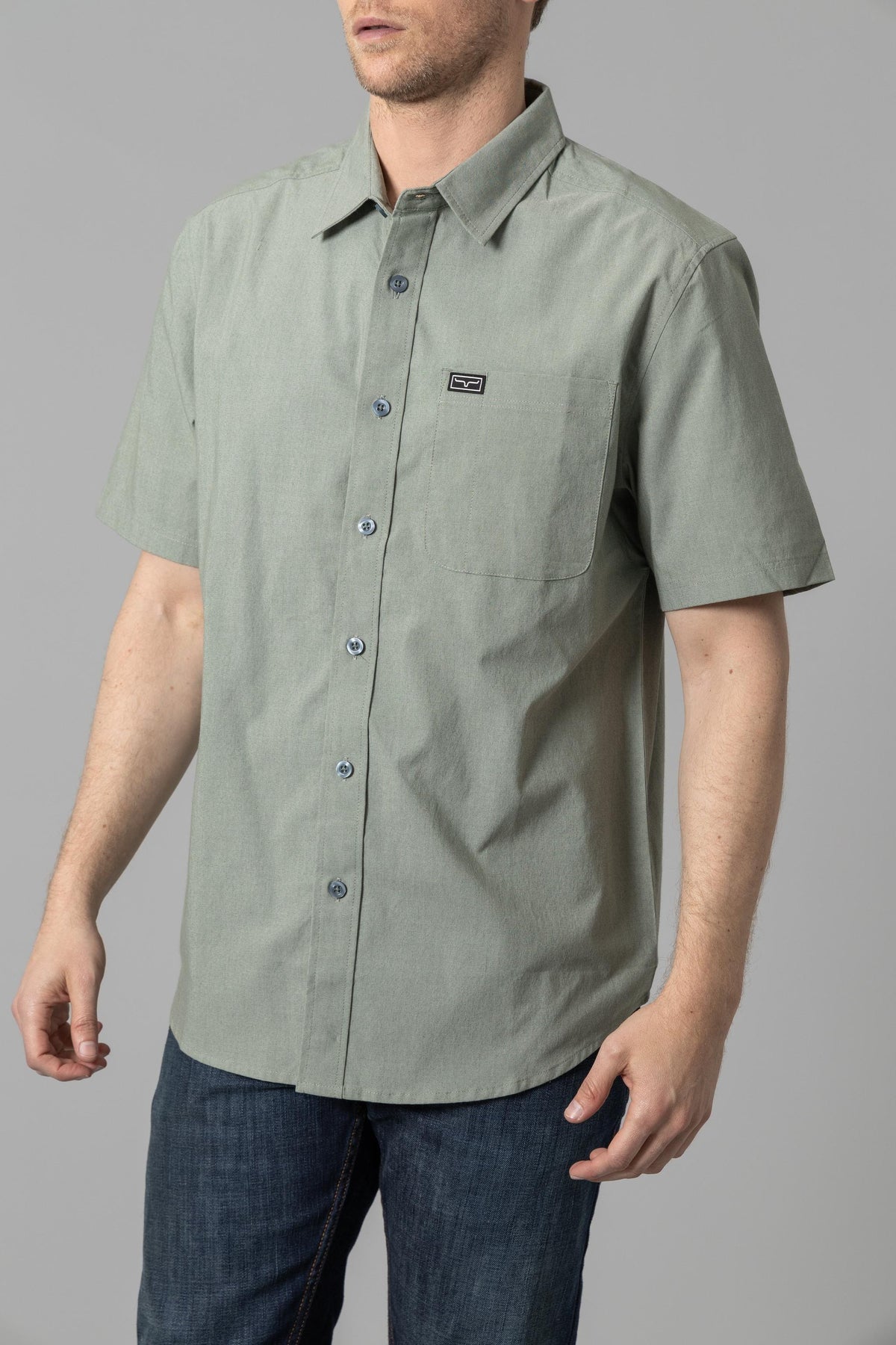 Kimes Ranch Linville Short Sleeve Dress Shirt in Grey Sage with a chest pocket and logo patch