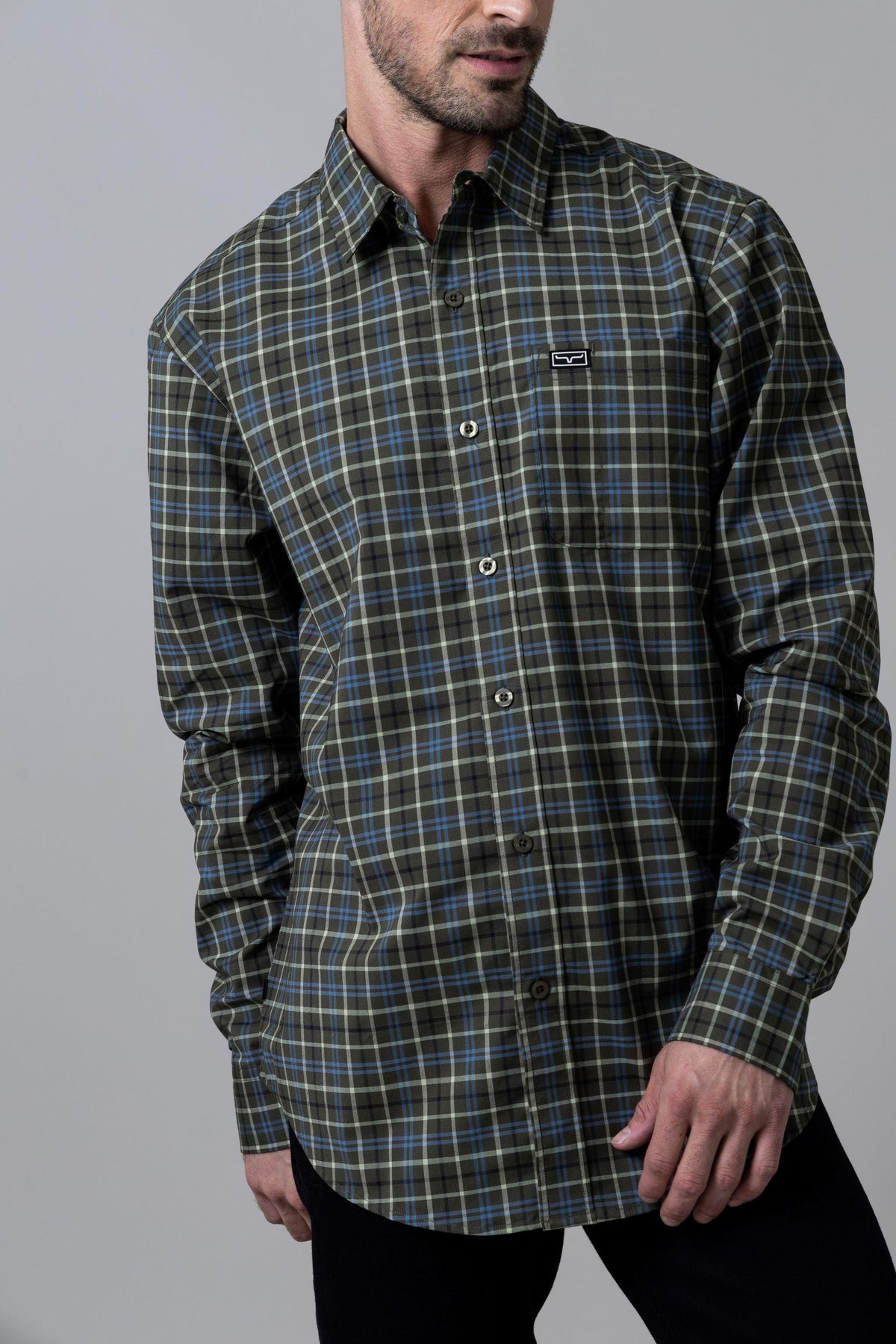 Kimes Ranch Lucas dress shirt in Army with a plaid pattern and a chest pocket with the Kimes Ranch logo