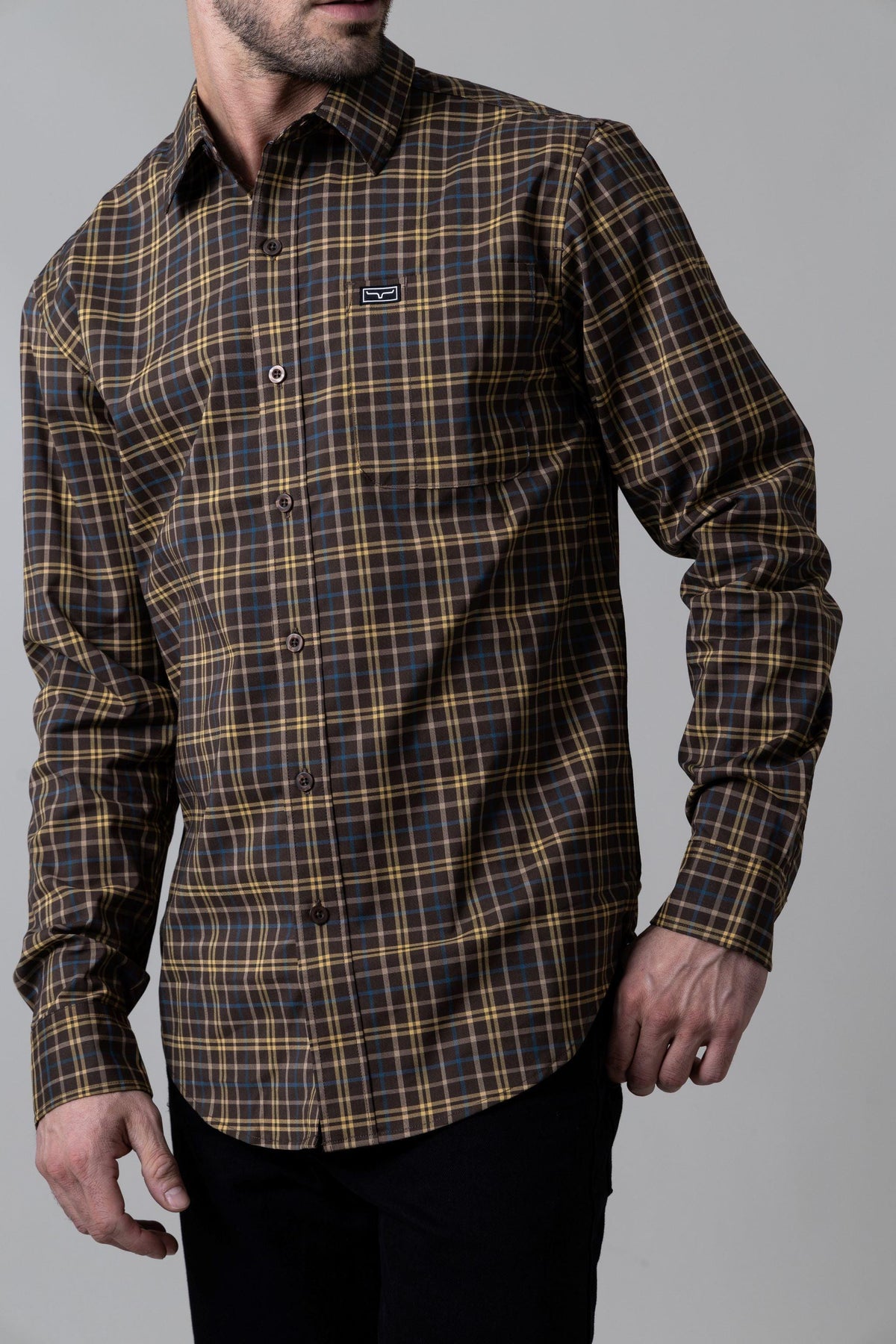 Kimes Ranch Lucas dress shirt in Navy with a brown and yellow plaid pattern and a chest pocket with the Kimes Ranch logo