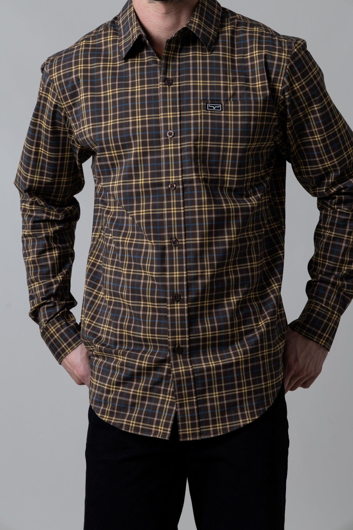 Kimes Ranch Lucas dress shirt in Navy with a plaid pattern and a chest pocket with the Kimes Ranch logo