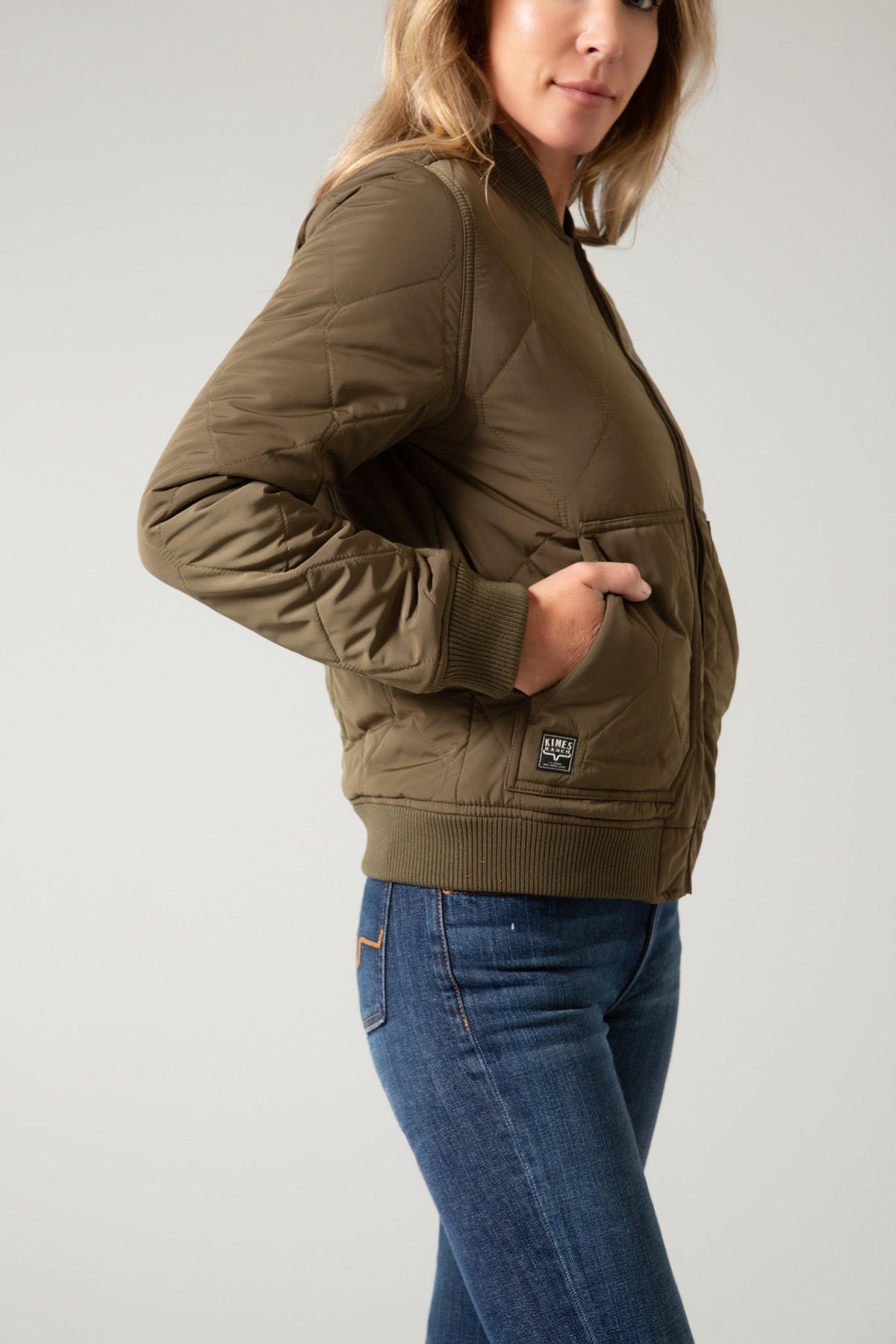 Kimes Ranch Marino Bomber Jacket in Dark Army, side view, with diamond quilting and ribbed cuffs