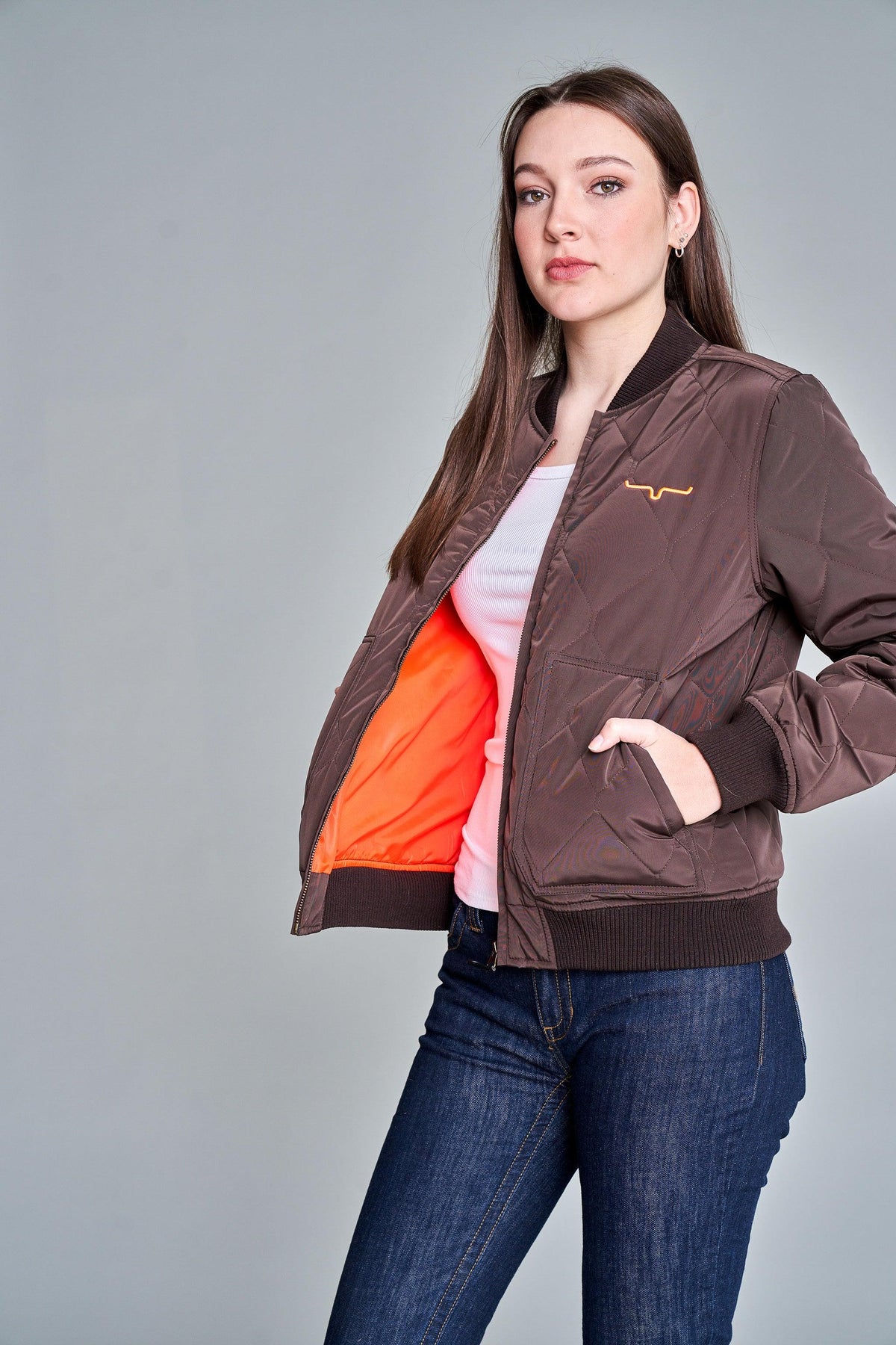 Kimes Ranch Marino Bomber Jacket in Brown, side view, with quilted diamond pattern and orange lining