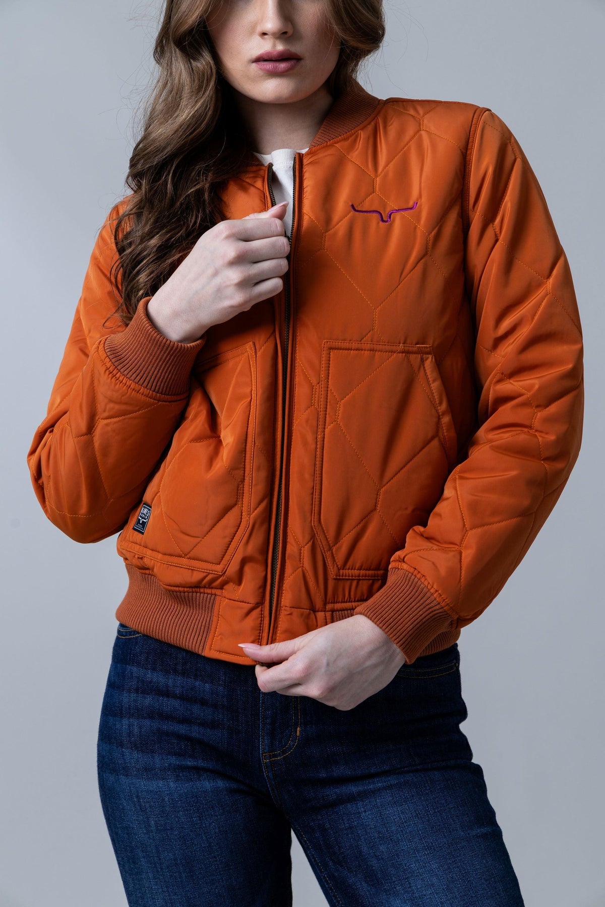 Kimes Ranch Marino Bomber Jacket in Burnt Orange with diamond quilting and front pockets