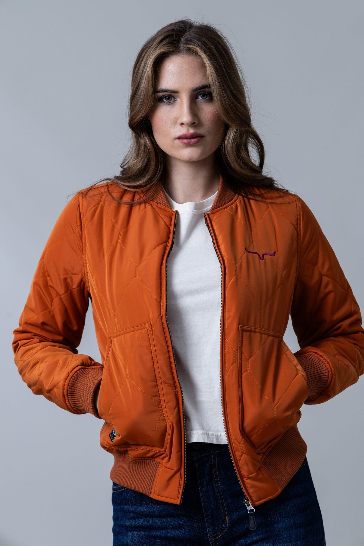 Kimes Ranch Marino Bomber Jacket in Burnt Orange with diamond quilting and front pockets