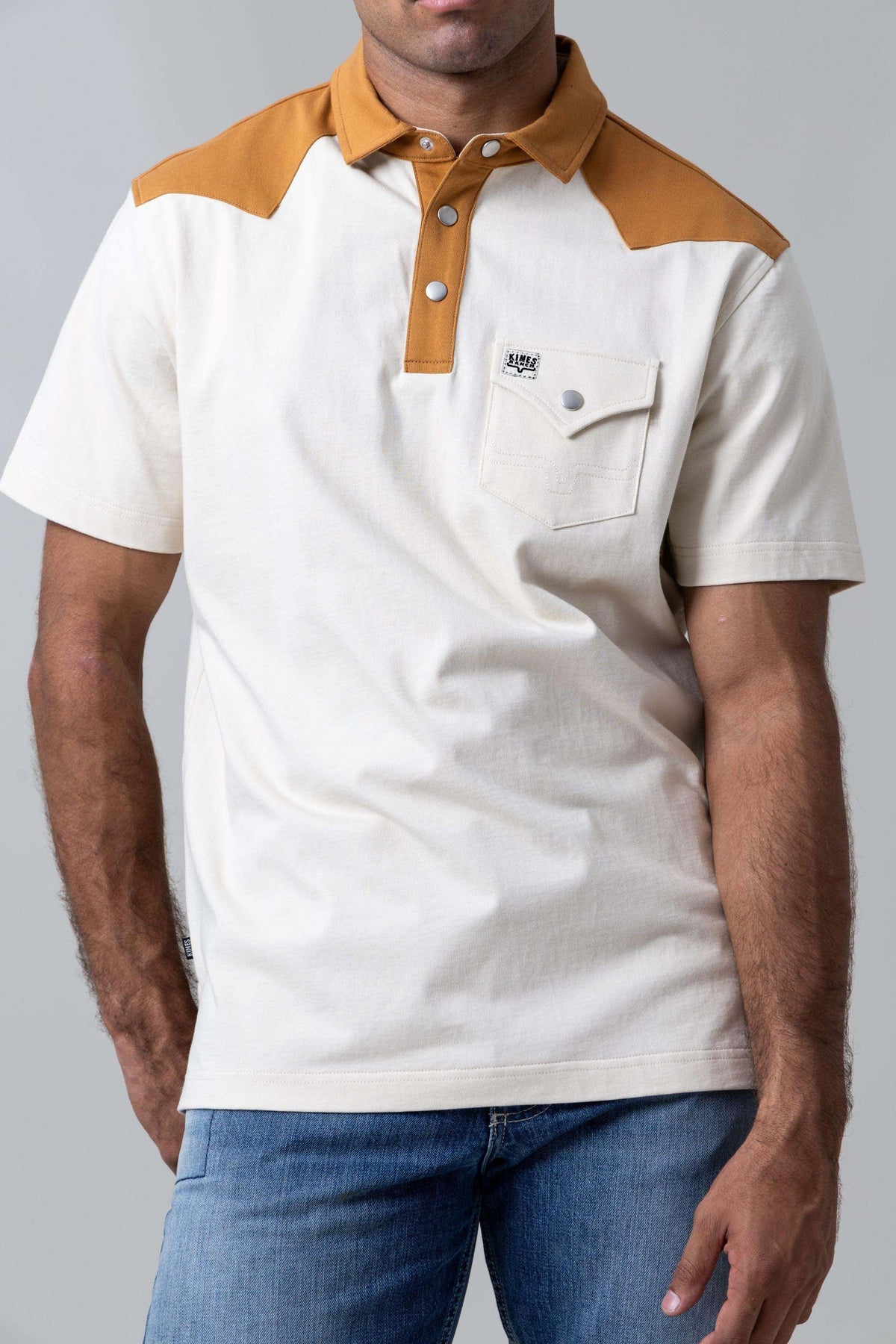Kimes Ranch Gallup Polo in Natural with a tan collar and yoke and a chest pocket with a logo