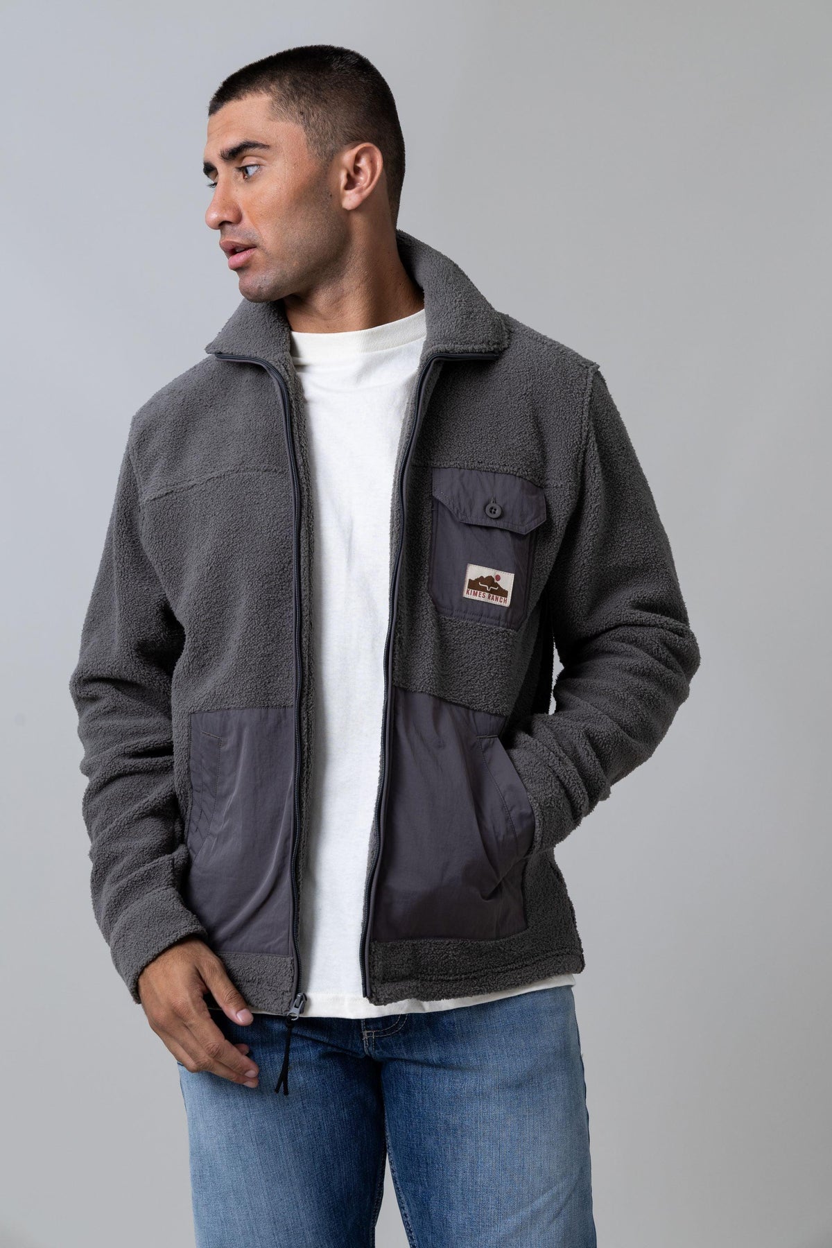 Kimes Ranch Maxwell Grey Heather sweatshirt with a stand collar, zip front, and contrast fabric lower body with chest pocket