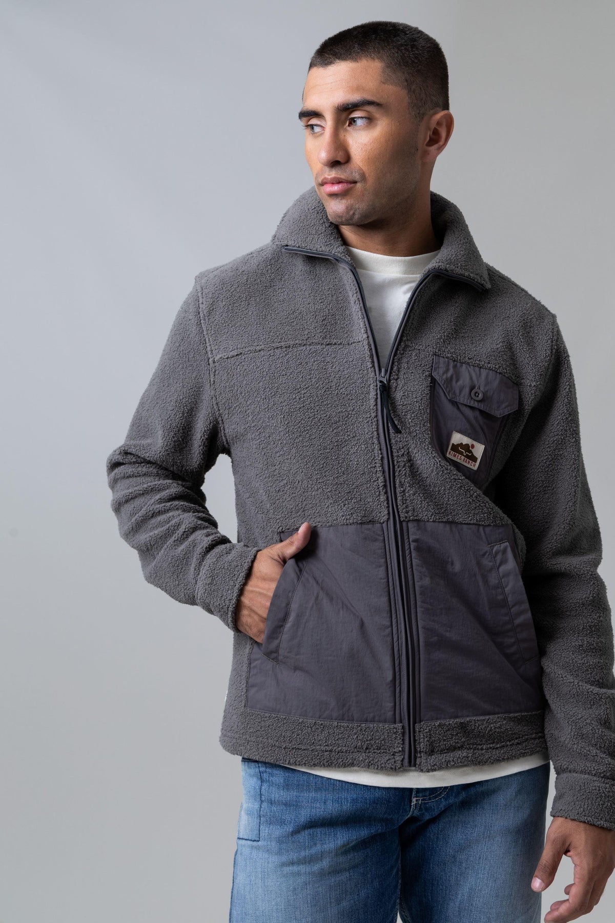 Kimes Ranch Maxwell Grey Heather sweatshirt with a stand collar, zip front, and contrasting lower panel with patch pockets