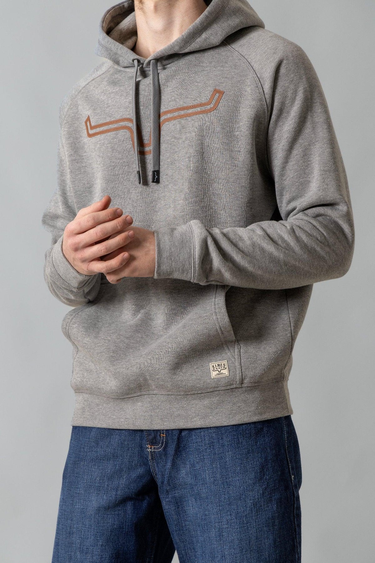 Kimes Ranch Outlier Hoodie in Grey Heather with a front kangaroo pocket and a Kimes Ranch logo patch