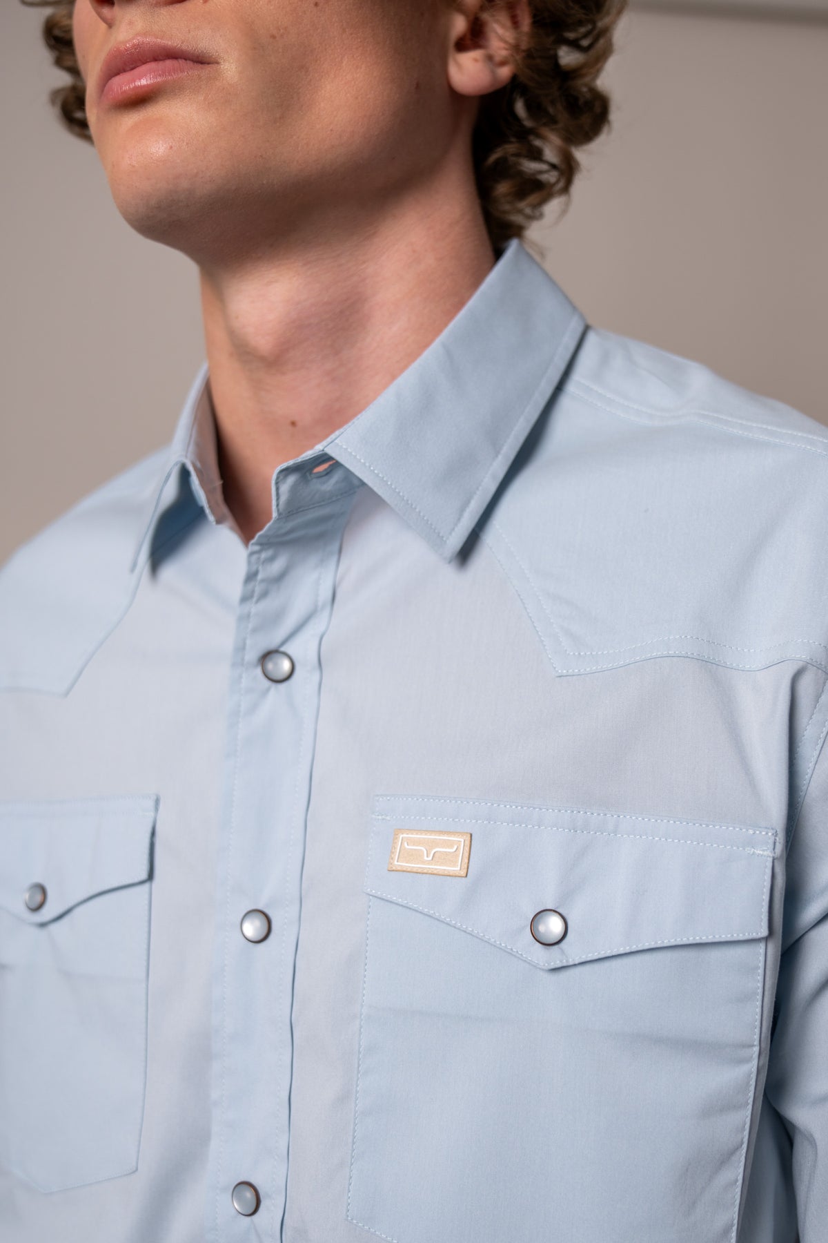 Kimes Ranch Rio Short Sleeve Dress Shirt in Light Blue with a close-up of the collar and chest pockets