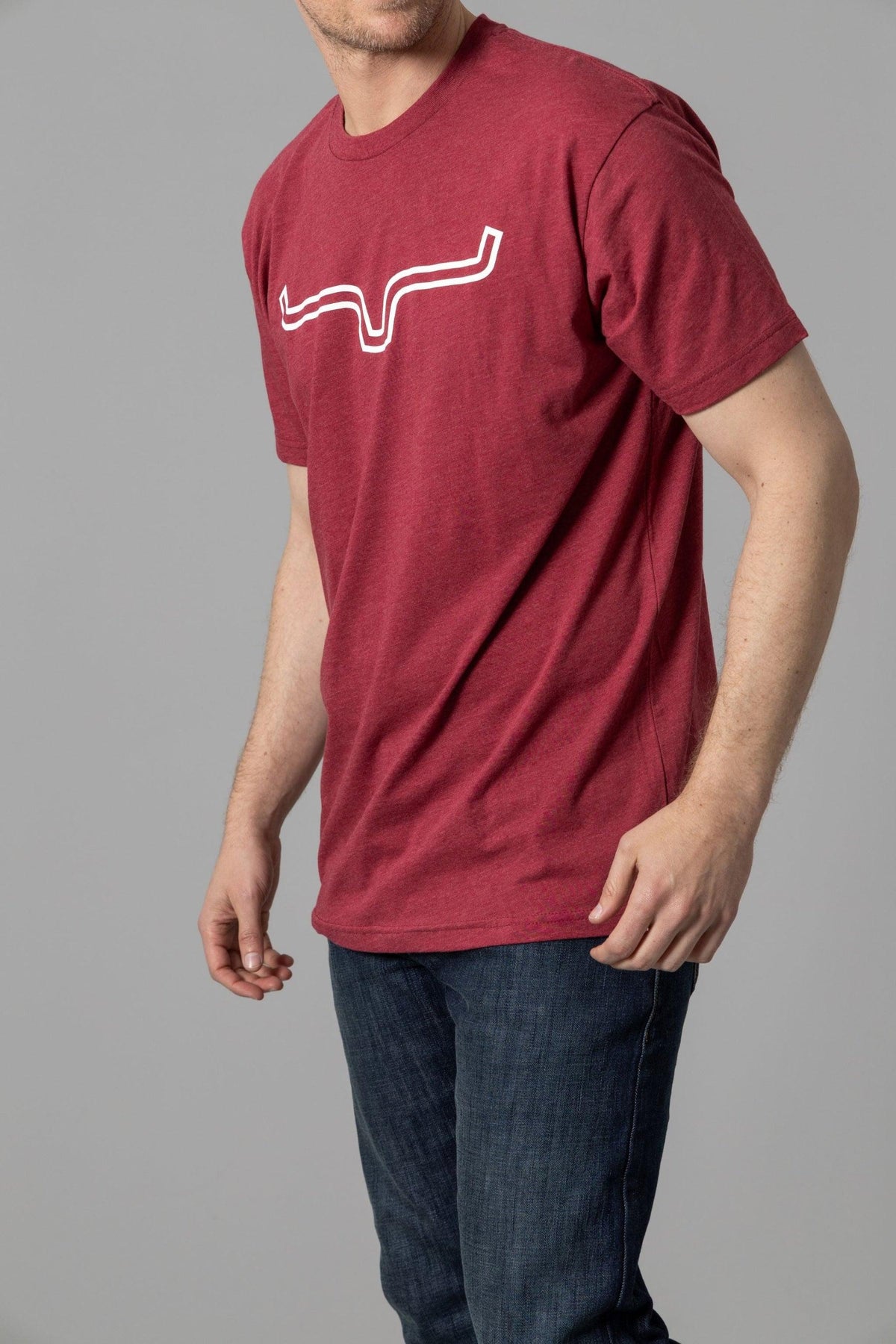 Kimes Ranch Outlier Shirt in Cardinal, side view, with a white wavy line graphic on the chest