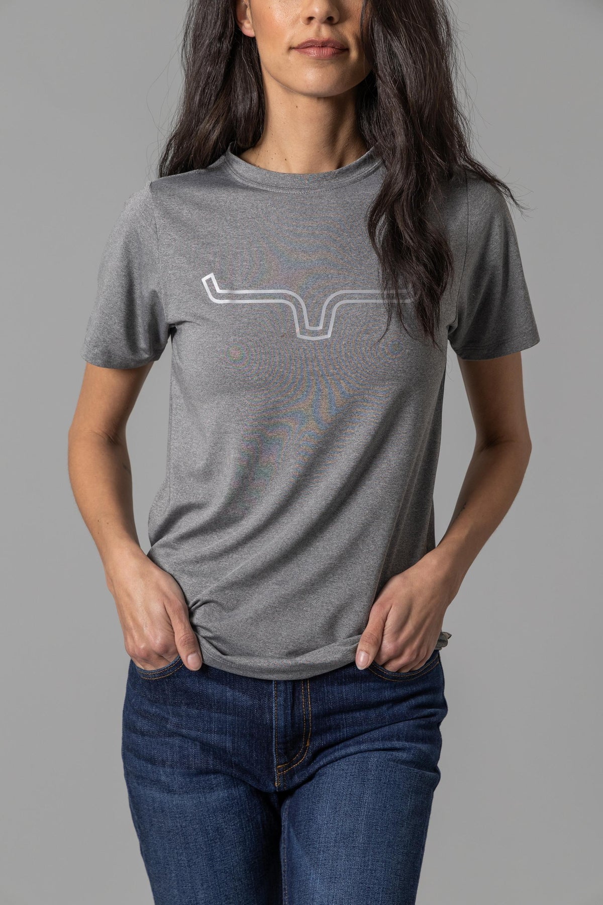 Kimes Ranch Ladies Outlier Tech Tee Shirt in Charcoal Heather with a white longhorn logo and subtle graphic print