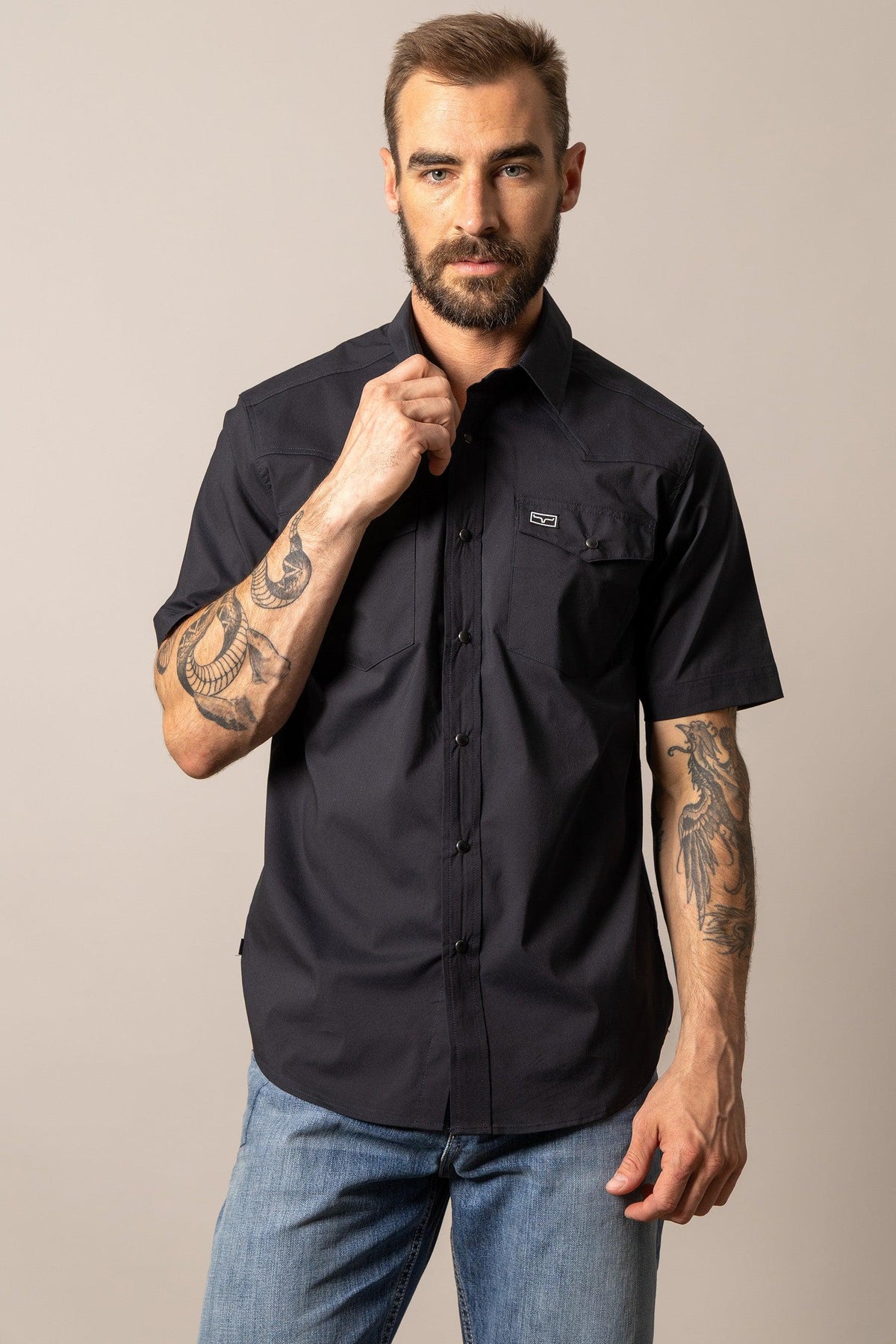 Kimes Ranch Rio Short Sleeve Dress Shirt in Black with a collar, button front, and chest pockets