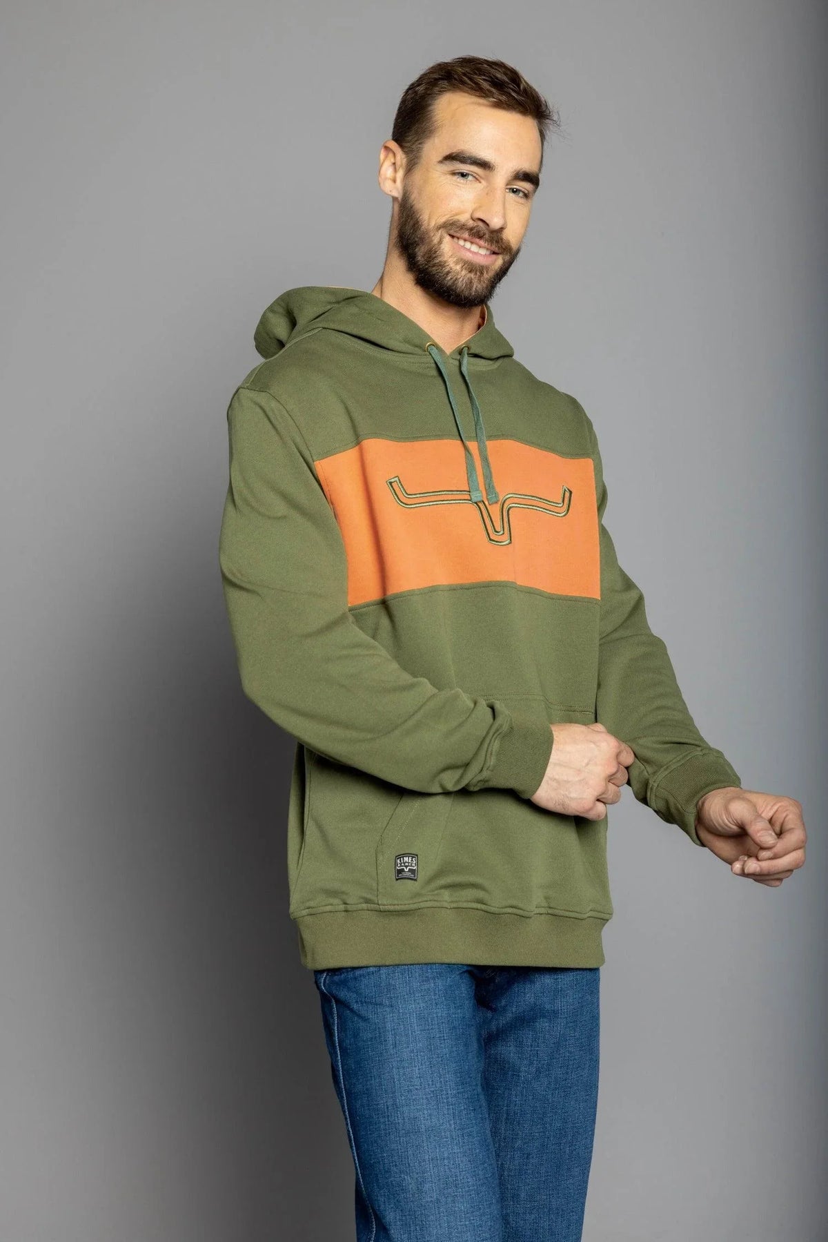 Kimes Ranch Side Winder Hoodie in Army, side view, with orange chest panel and longhorn logo