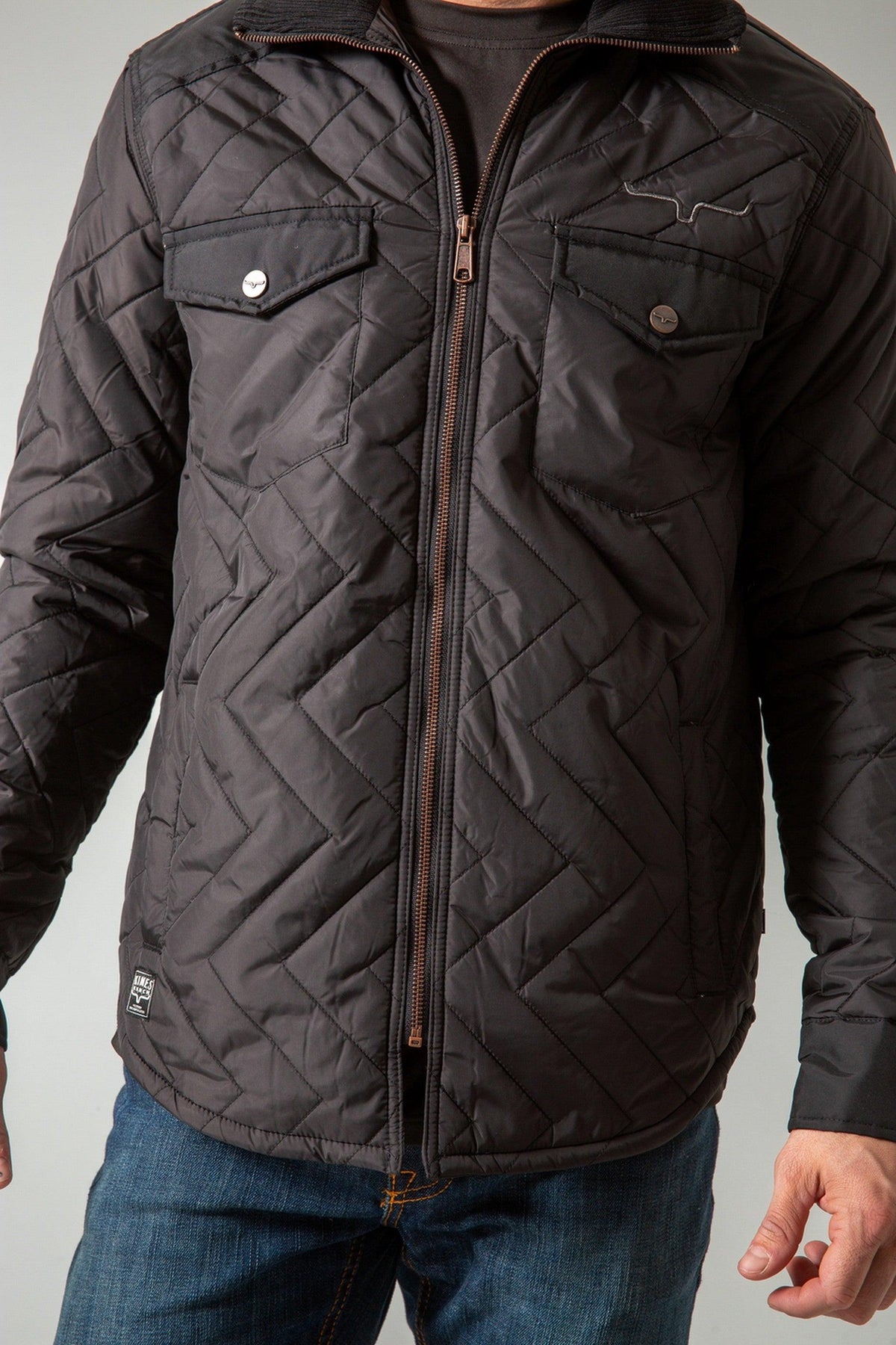 Kimes Ranch Skink Jacket in Black with chevron quilting, two front pockets with snap closures, and a front zipper