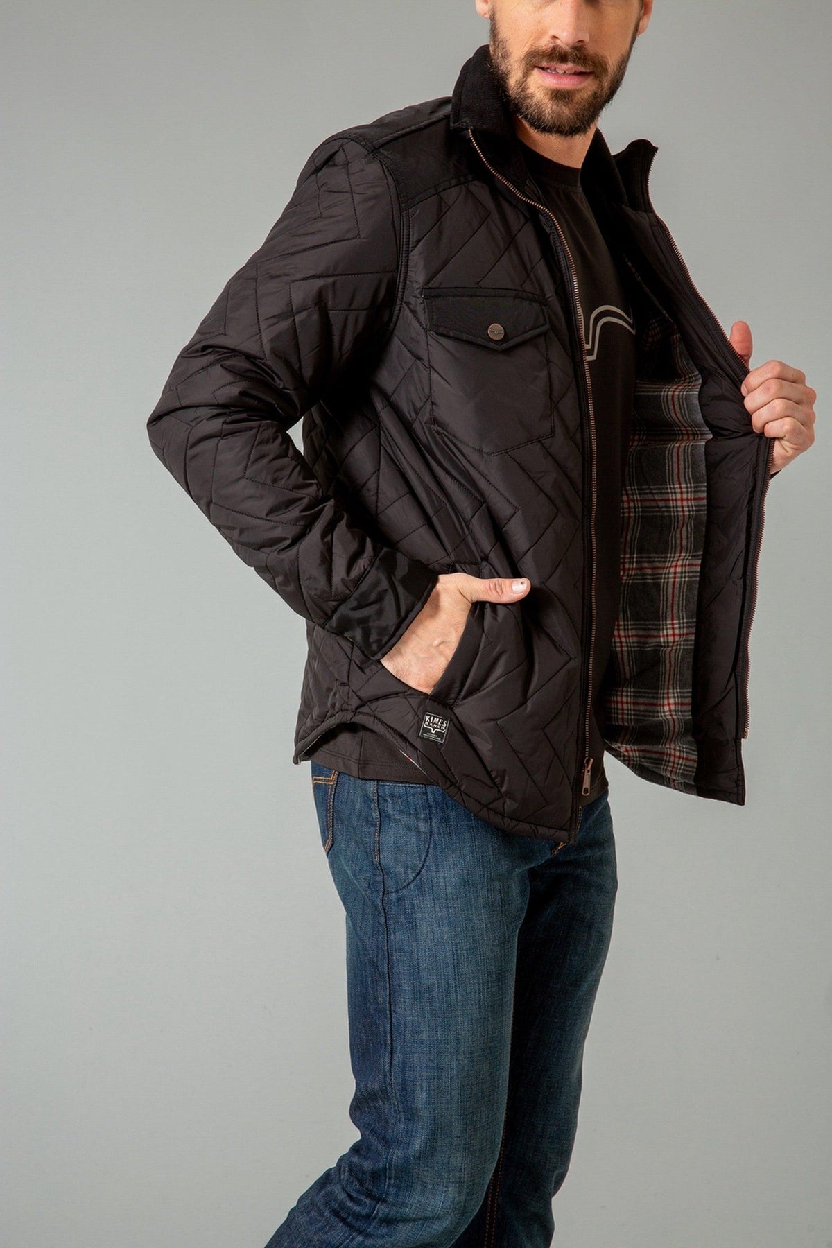 Kimes Ranch Skink Jacket in Black, side view, with diamond quilting and plaid lining