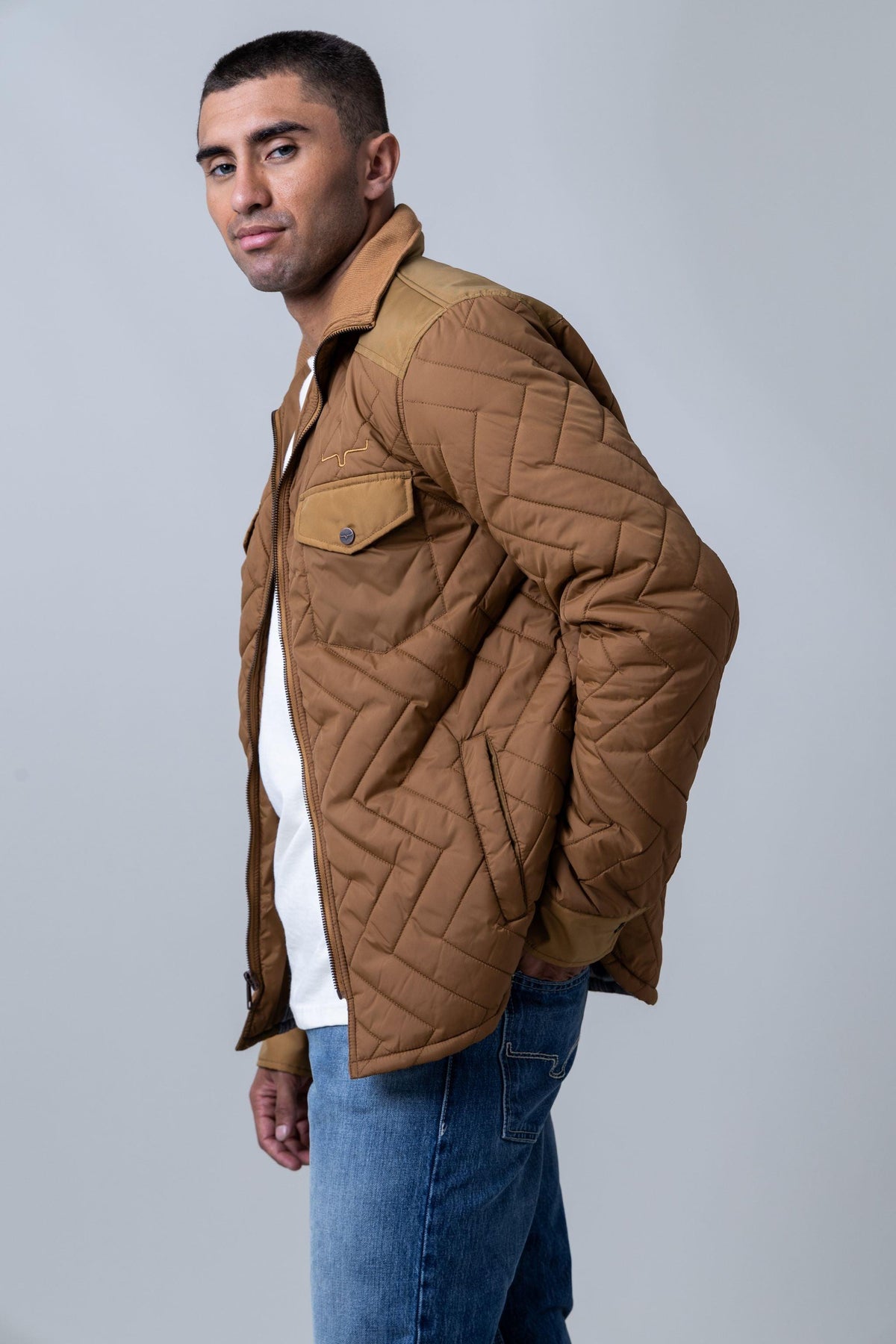 Kimes Ranch Skink Jacket in Work Wear Brown, side view, with chevron quilting and a front pocket