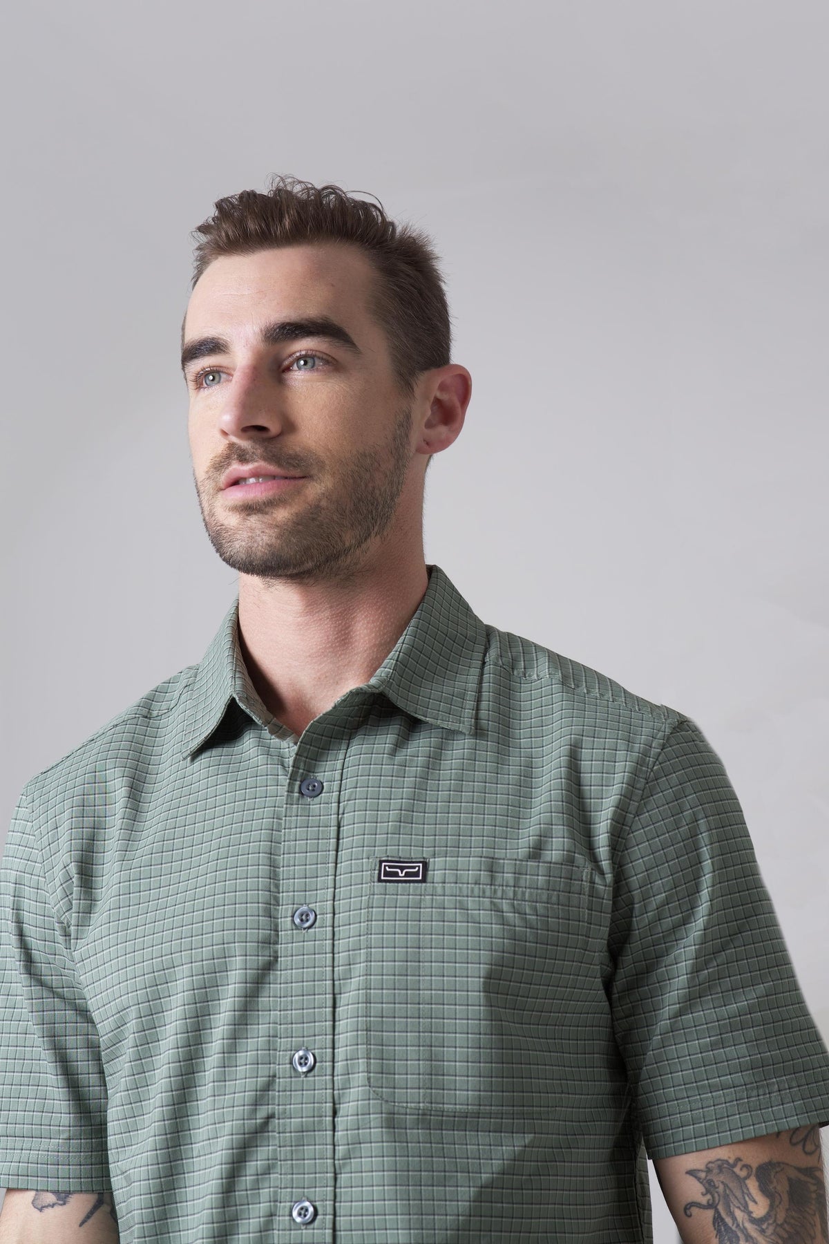 Kimes Ranch Spyglass Short Sleeve Dress Shirt in Sage with a check pattern and chest pocket