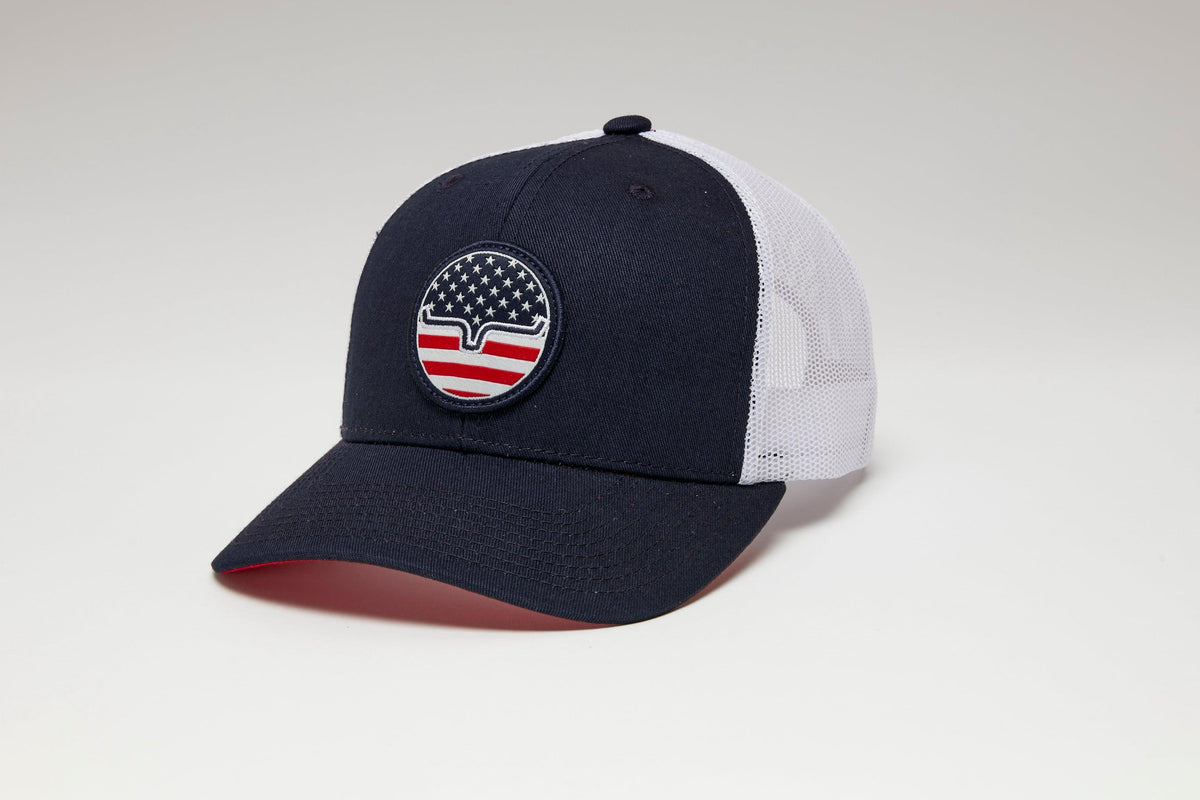Kimes Ranch Stars N Stripes Hat in Navy, side view, with white mesh back and a circular Kimes Ranch logo