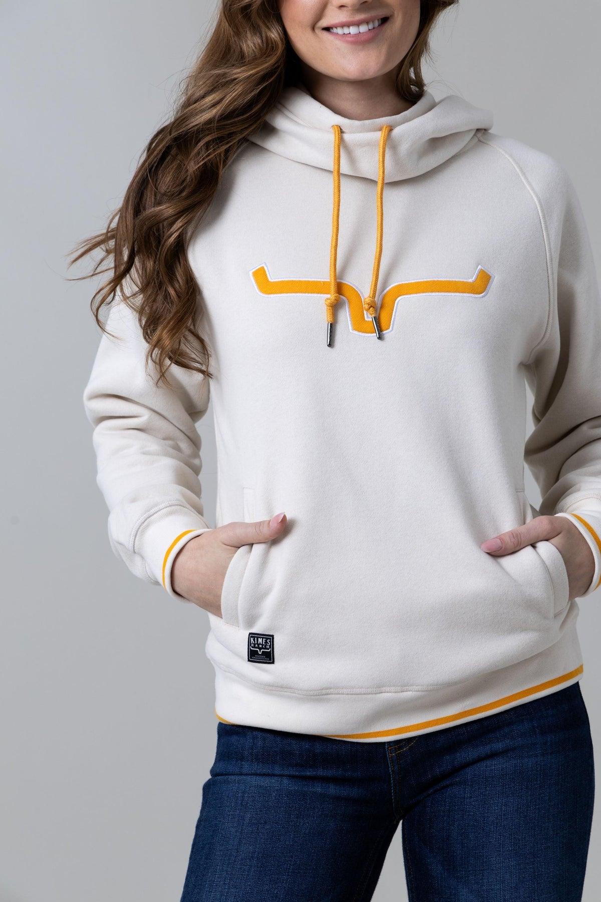 Kimes Ranch Two Scoops Hoodie in Natural with a yellow longhorn graphic and front kangaroo pocket