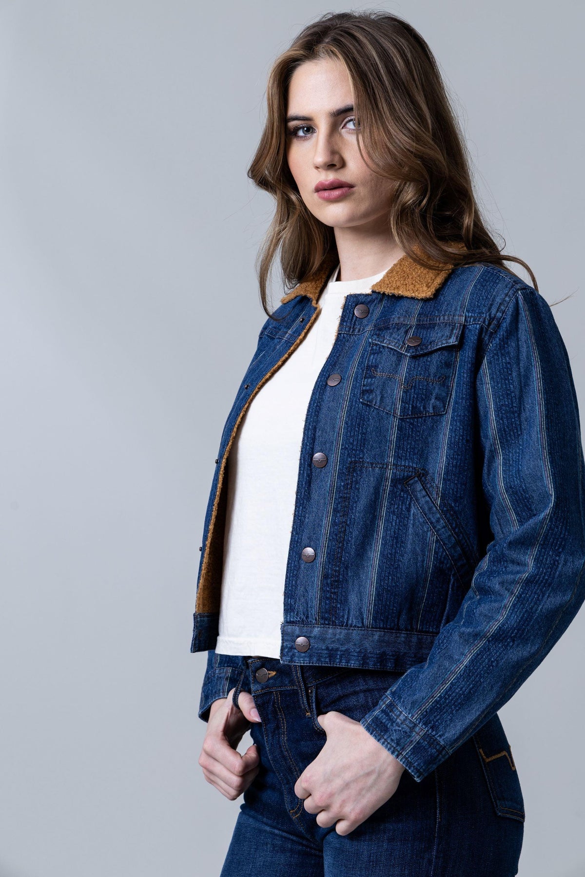 Kimes Ranch Vaquero Trucker jacket in Dark Indigo, side view, with a sherpa collar and button front
