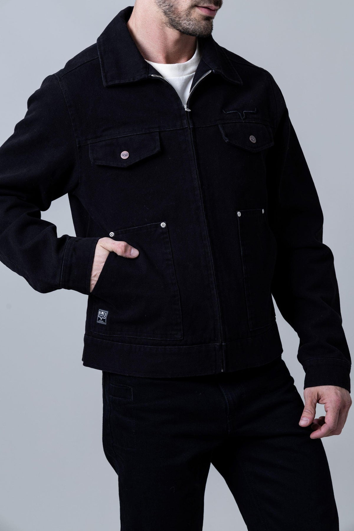 Kimes Ranch Logan Jacket in Black with a zip front, two chest pockets, and two lower pockets
