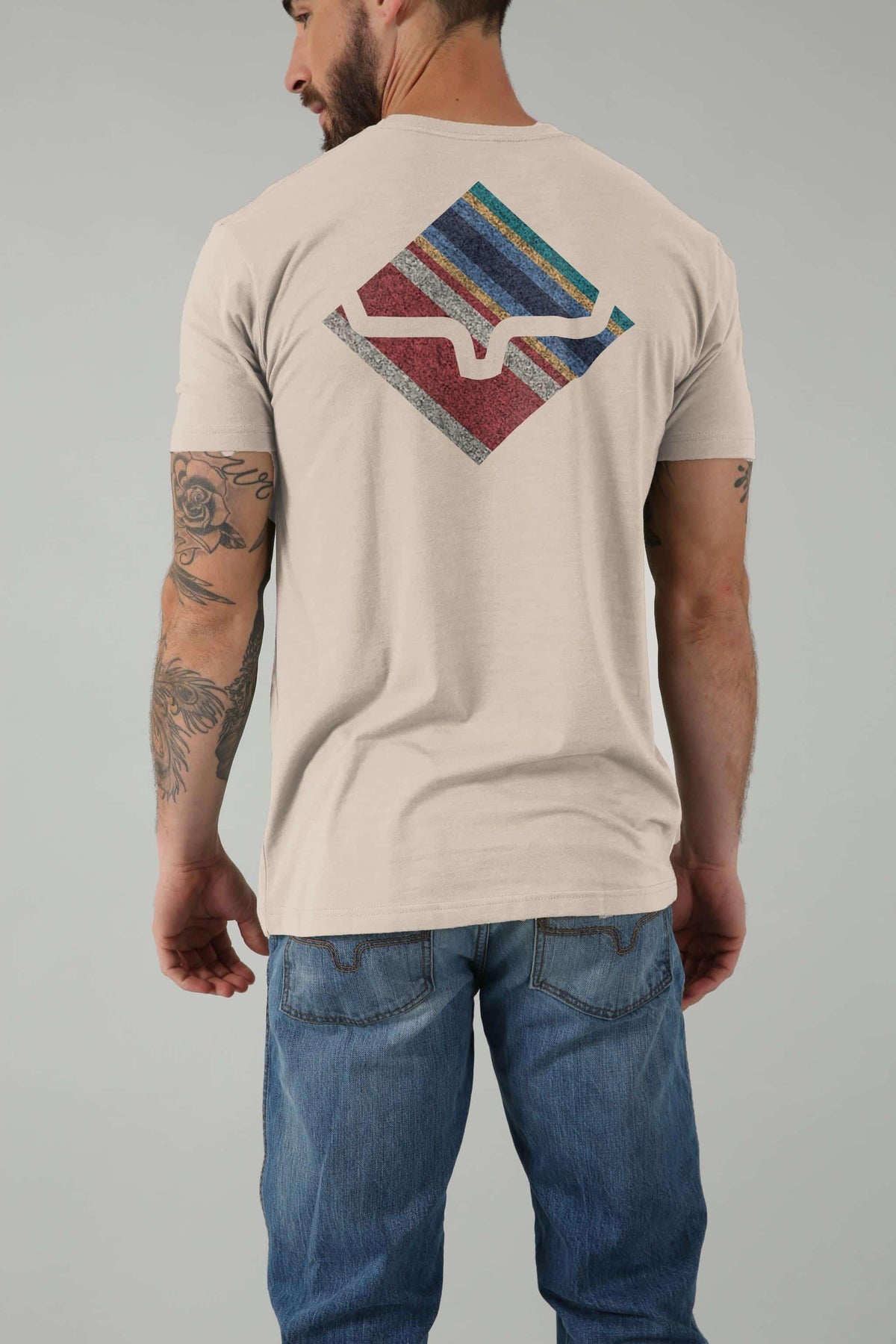 Kimes Ranch Warmth Shirt in Sand, back view, with a multicolor diamond graphic on the back