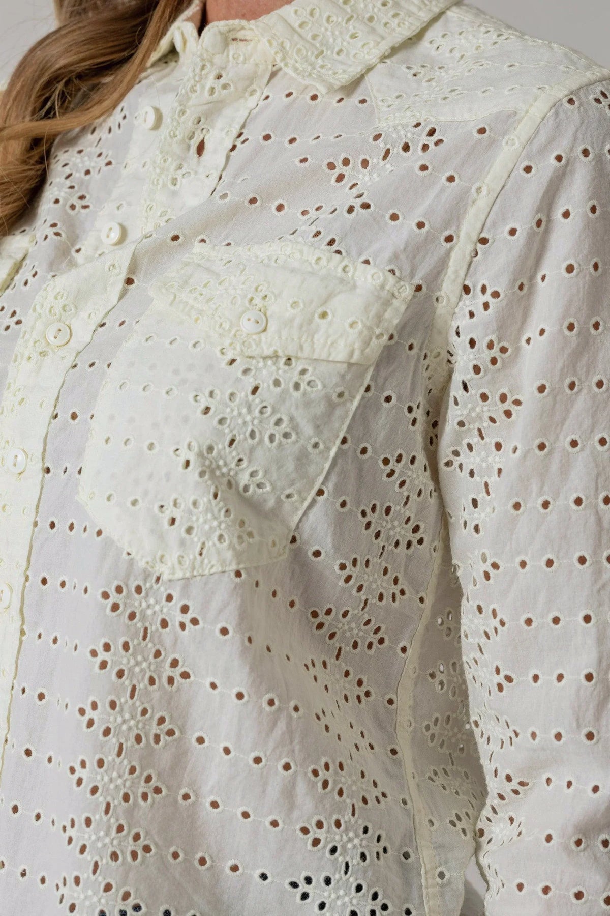 Kimes Ranch Rachel Eyelet Blouse, close-up, in cream with a button-front pocket and floral cutwork pattern