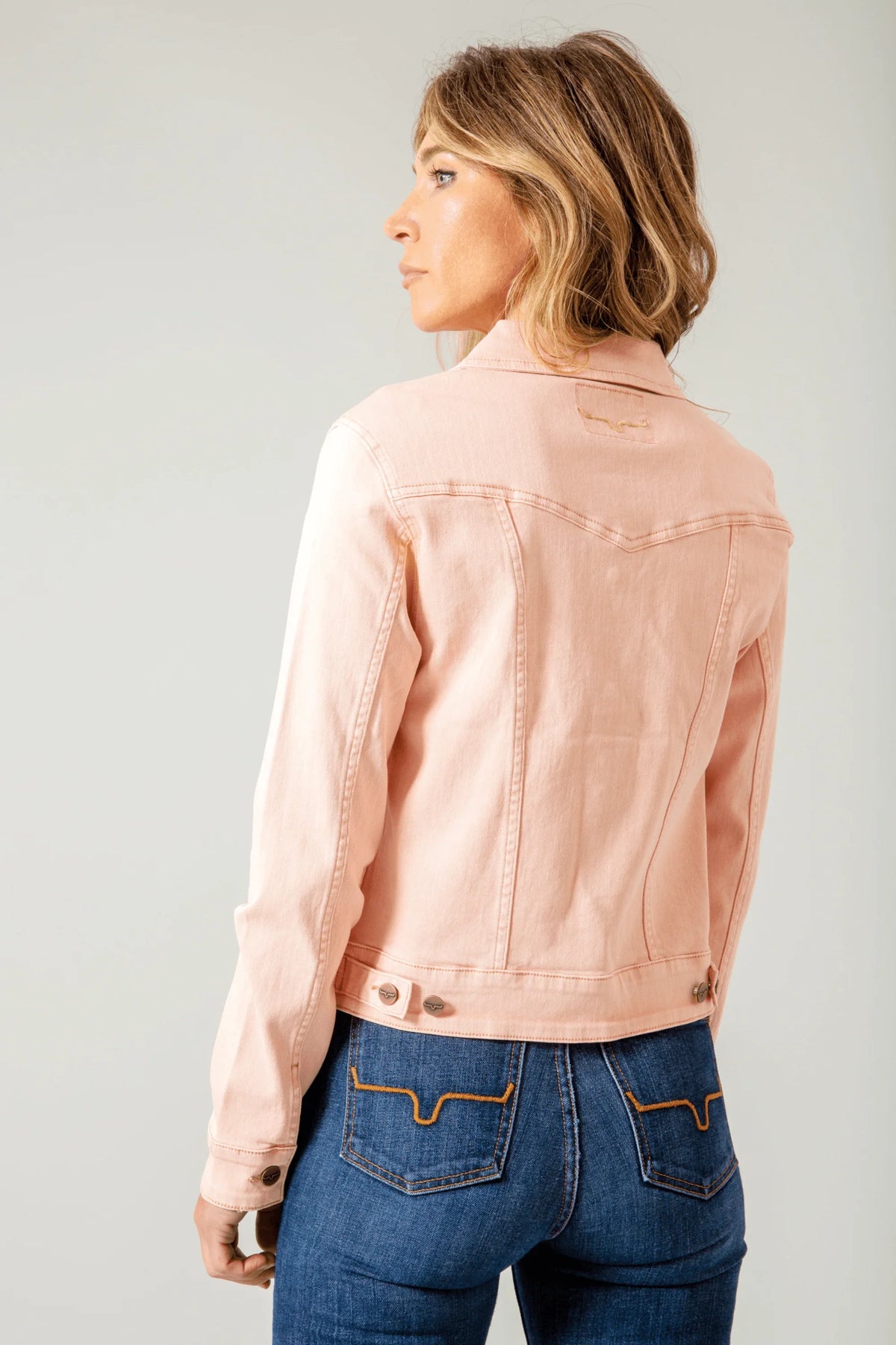 Kimes Ranch Winslow Trucker Jacket in Evening Sand, back view, with back yoke and adjustable waist tabs