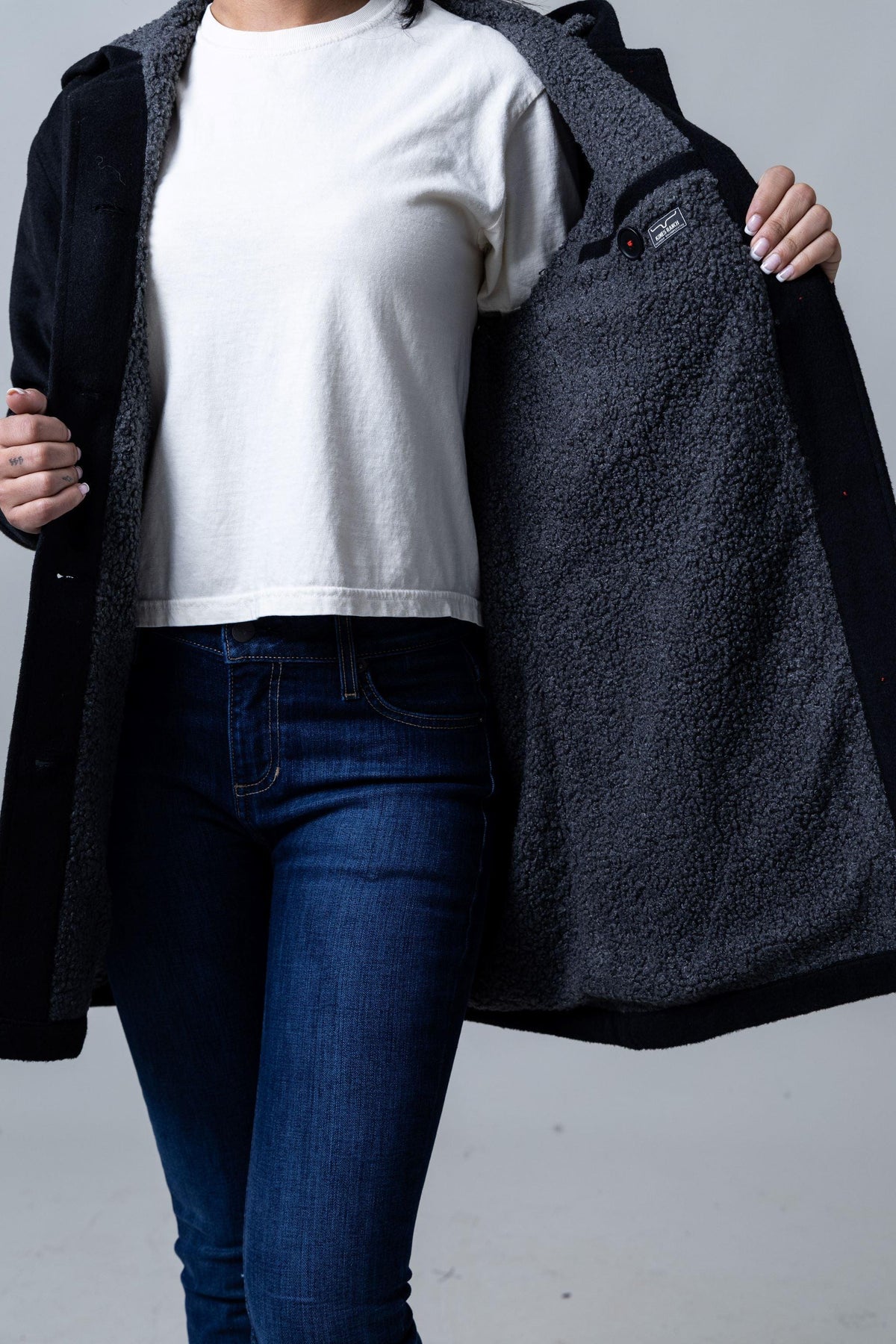 Kimes Ranch Tatum Coat in Black with a grey sherpa lining and Kimes Ranch logo patch