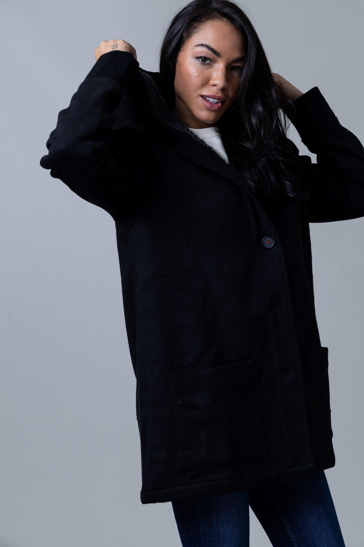 Kimes Ranch Tatum Coat in Black with a sherpa-lined hood and front patch pockets