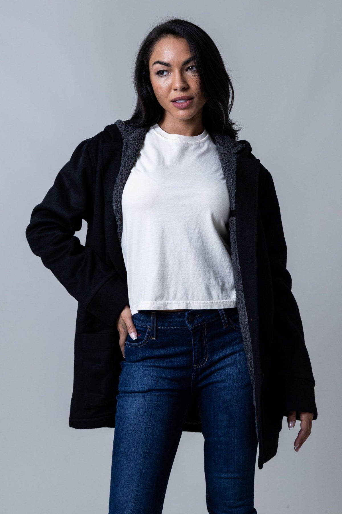 Kimes Ranch Tatum Coat in black with a grey sherpa hood lining and front pockets