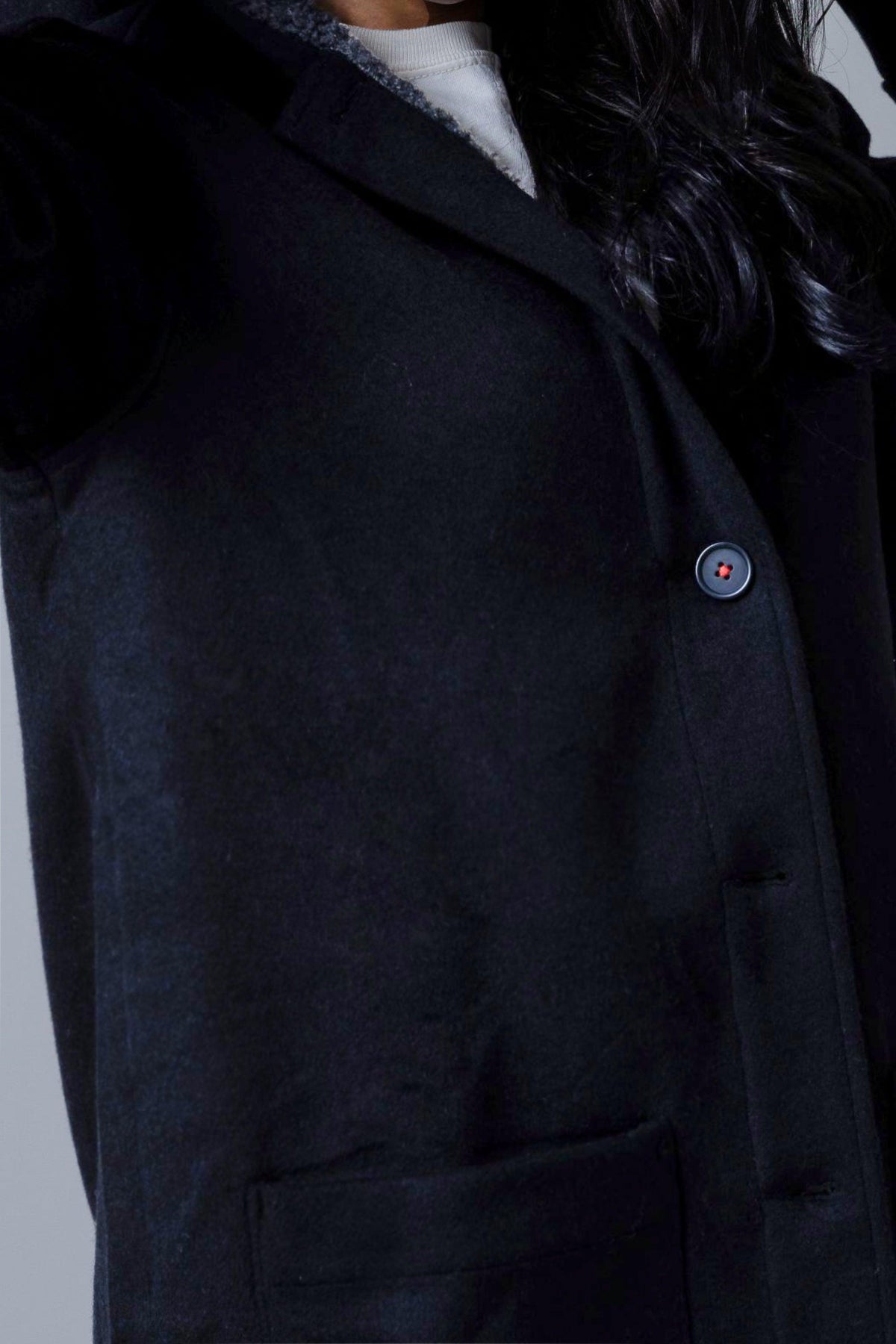 Kimes Ranch Tatum Coat in Black with a close-up of the front button and patch pocket
