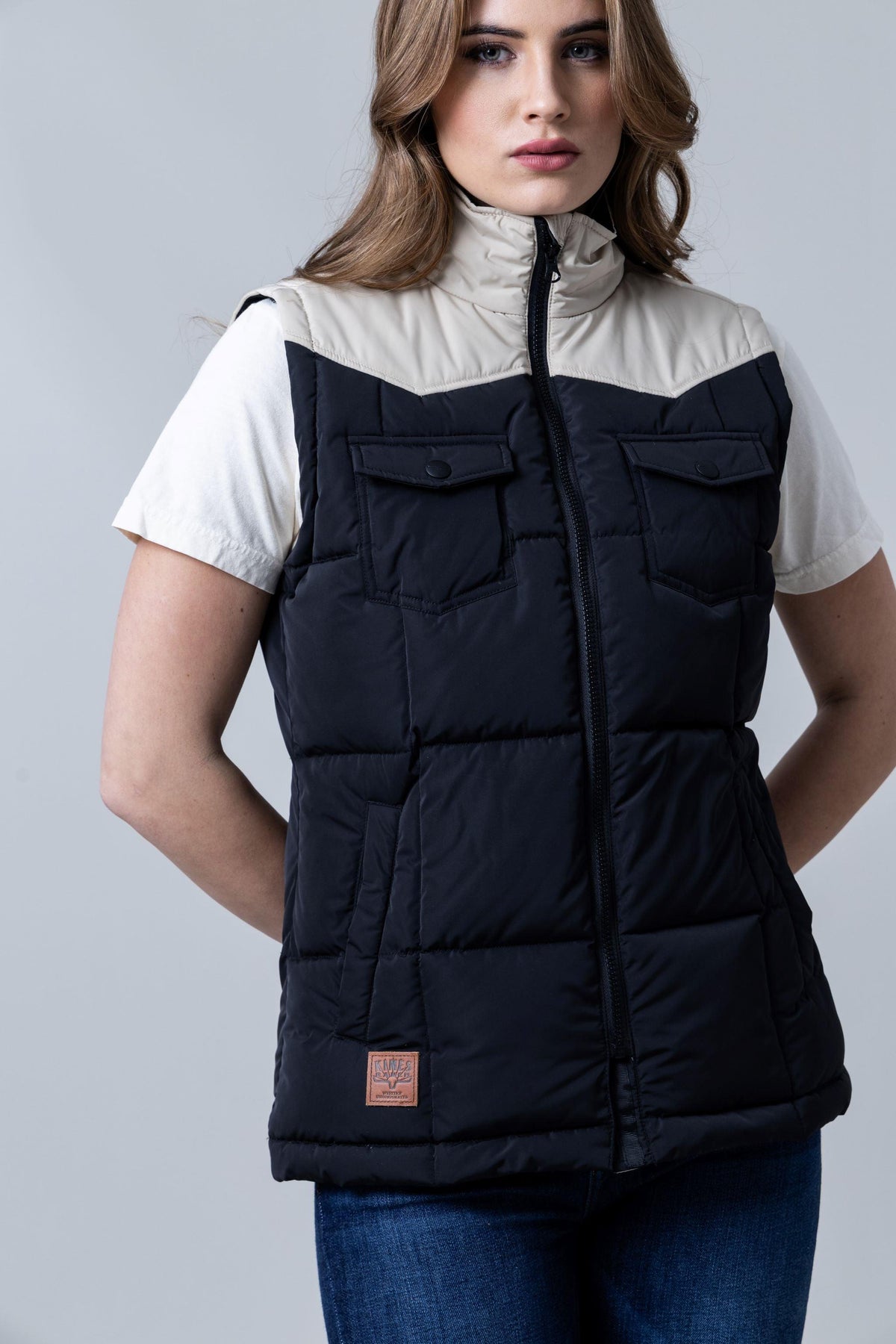 Kimes Ranch Wyldfire Vest in Black with a colorblocked beige yoke and two button flap chest pockets