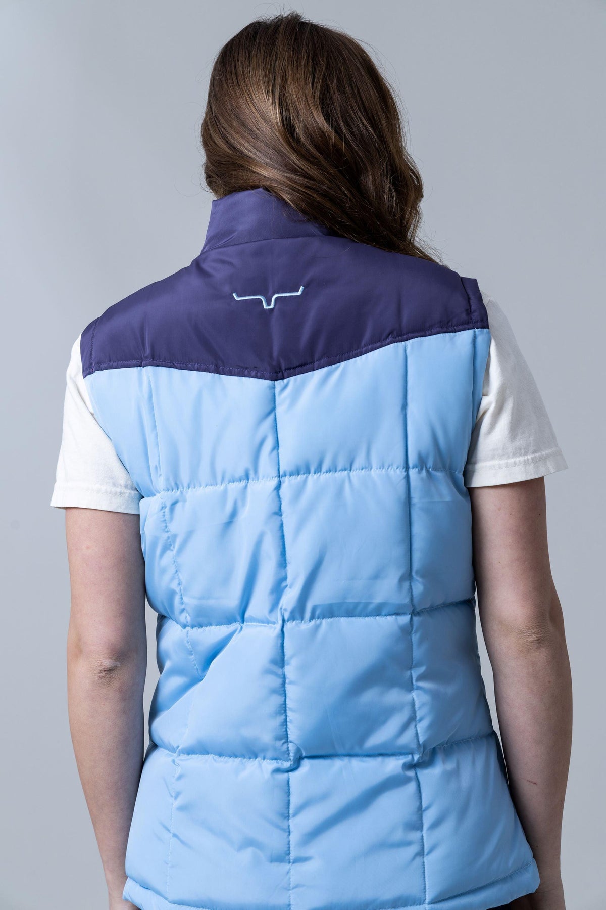 Kimes Ranch Wyldfire Vest in Sky Blue, back view, with a navy yoke and embroidered logo