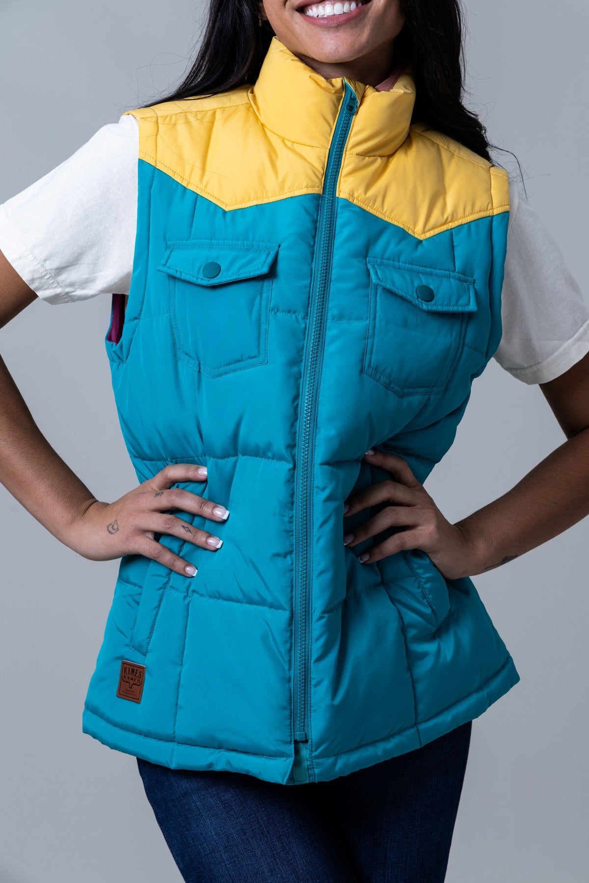Kimes Ranch Wyldfire Vest in Teal with a yellow collar and front pockets