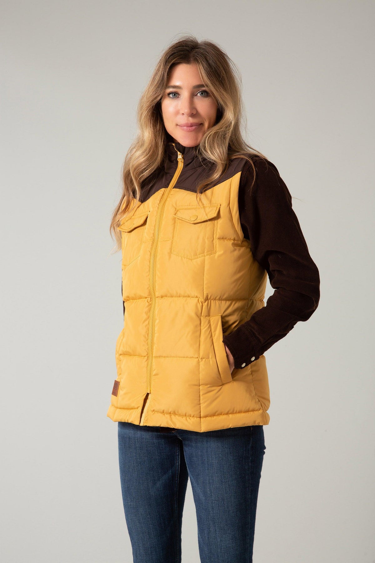 Kimes Ranch Wyldfire Vest in Mustard with brown yoke, zip front, flap pockets, and side pockets