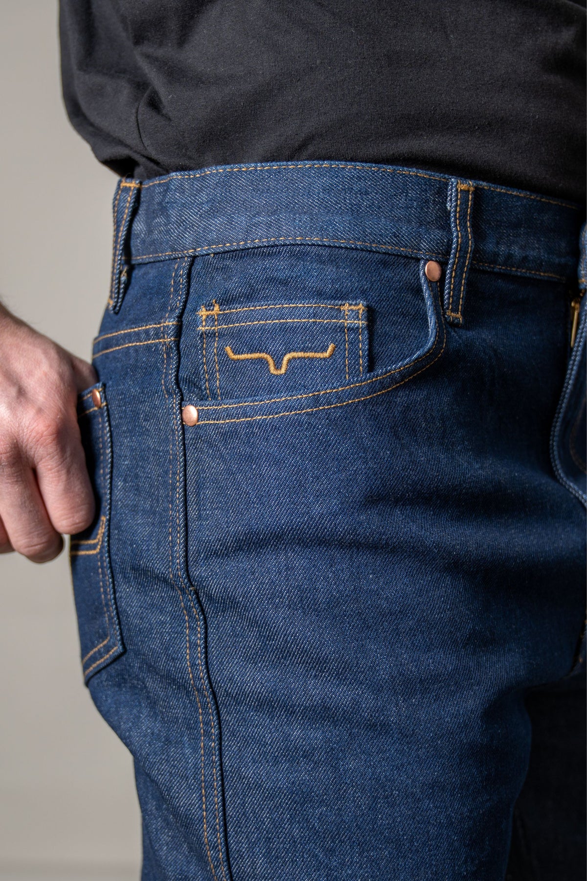 Kimes Ranch ZT jeans in Dark Wash with a close-up of the back pocket featuring the Kimes Ranch logo