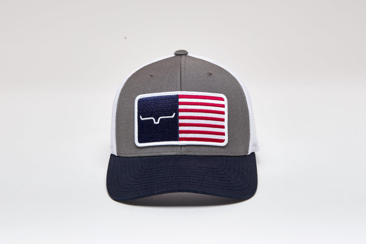 Kimes Ranch American Trucker Hat in Charcoal with navy brim and white mesh featuring a flag patch with the Kimes Ranch logo