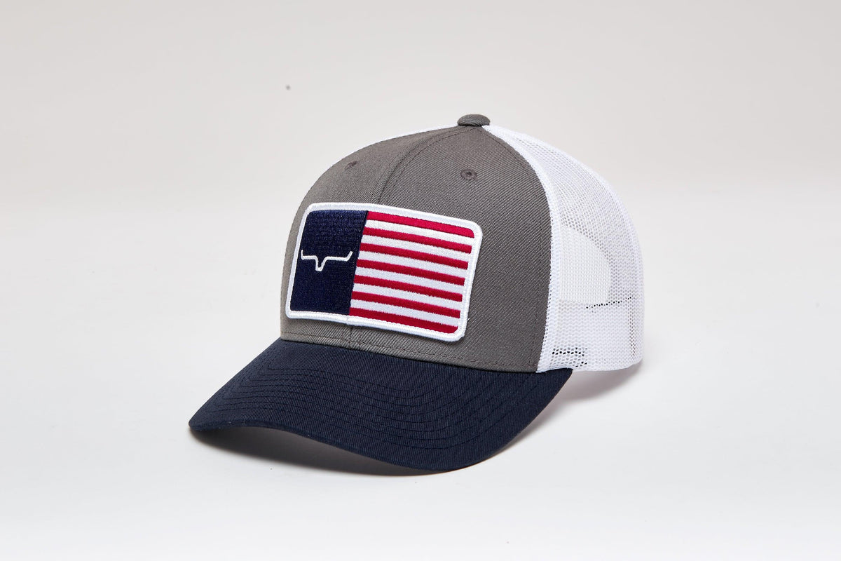 Kimes Ranch American Trucker Hat in Charcoal, side view, with navy brim and white mesh back featuring a Texas flag patch