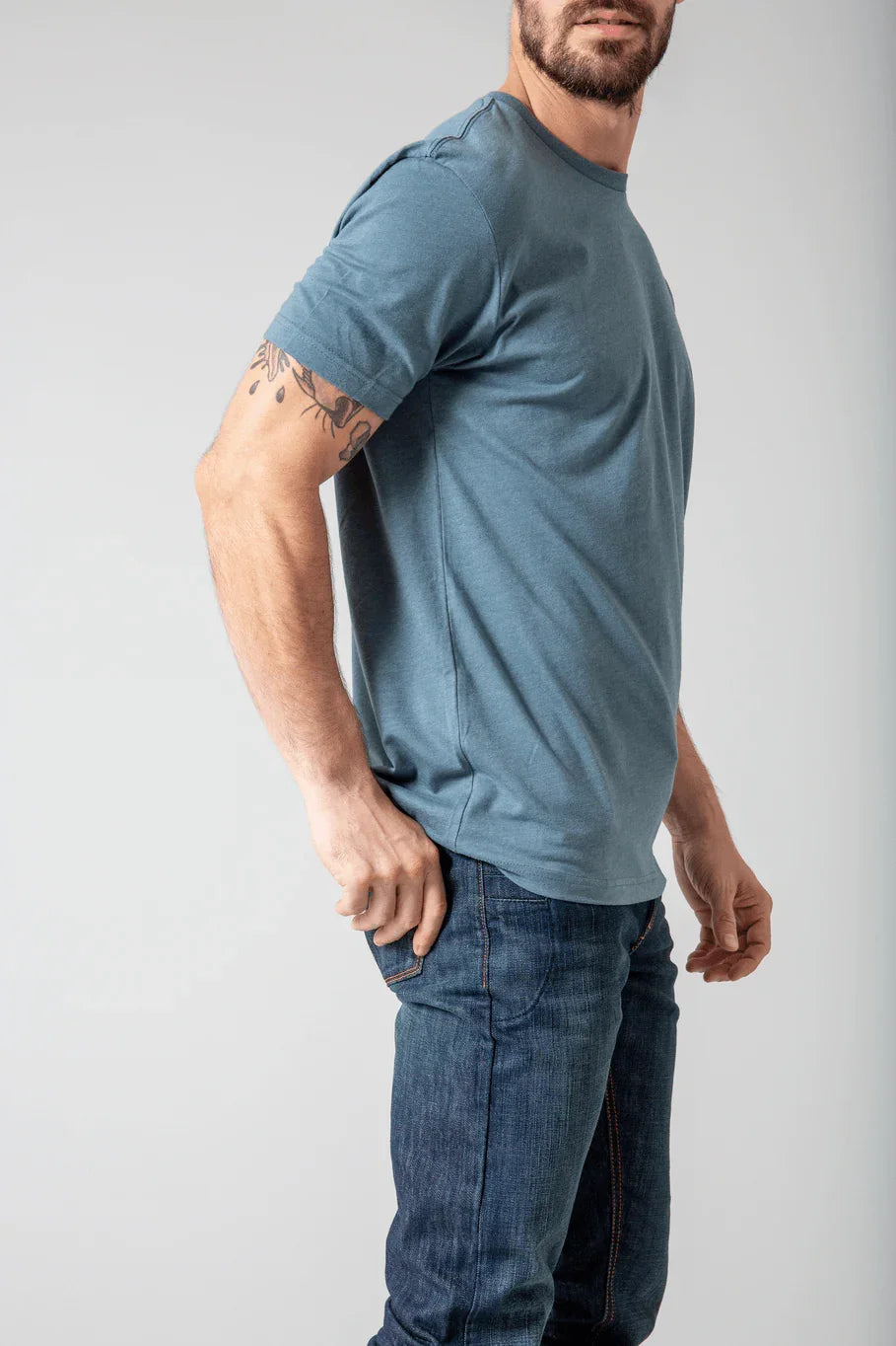 Kimes Ranch Shielded Trucker Shirt, side view, in blue with short sleeves and a crew neck