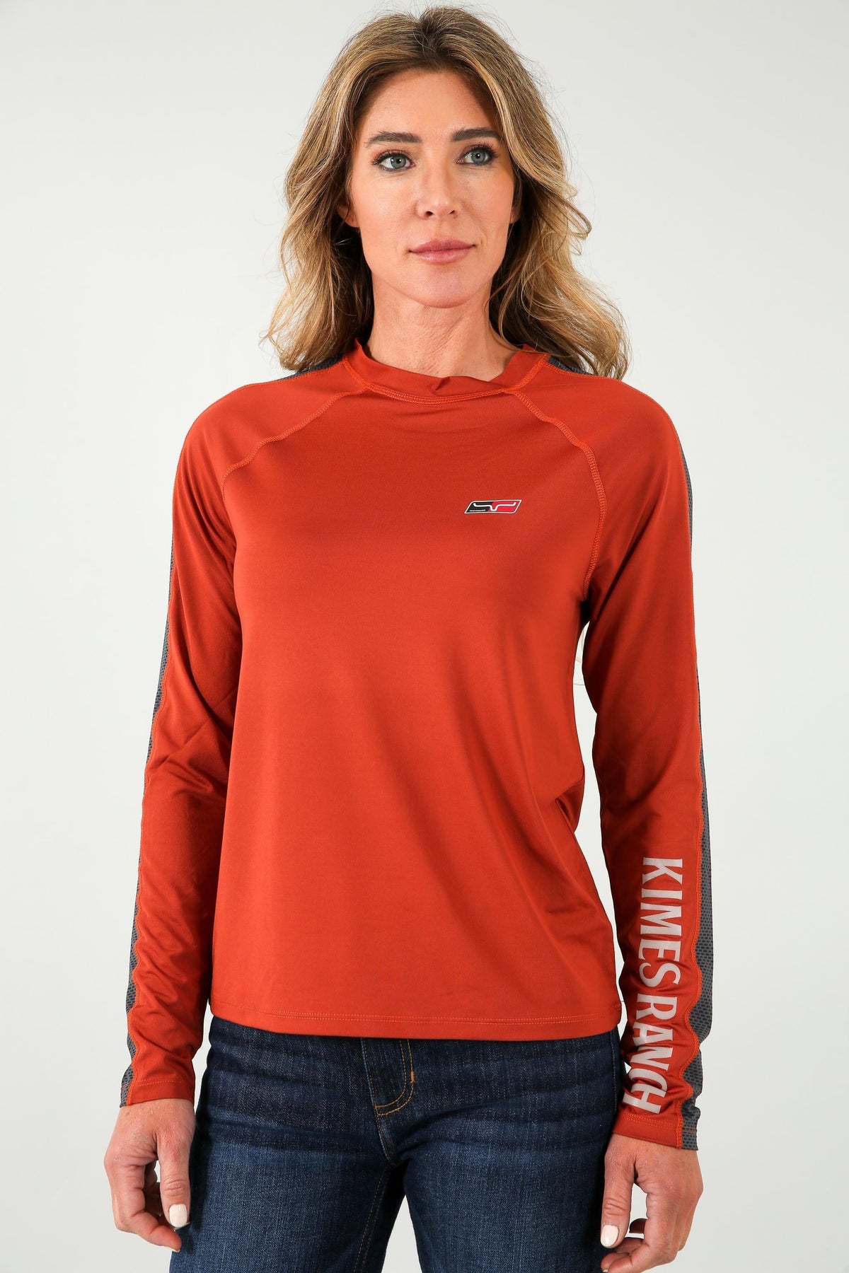 Kimes Ranch K1 Ls Tech Tee Shirt in Rust with a small chest logo and KIMES RANCH text on the sleeve