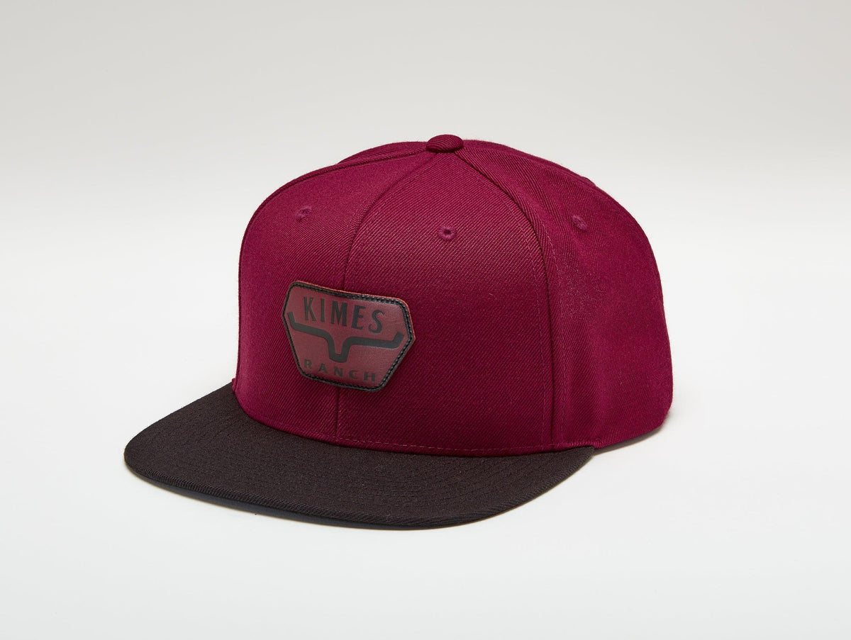 Kimes Ranch Premium Distance Hat in Rust with a black brim and the Kimes Ranch logo on the front