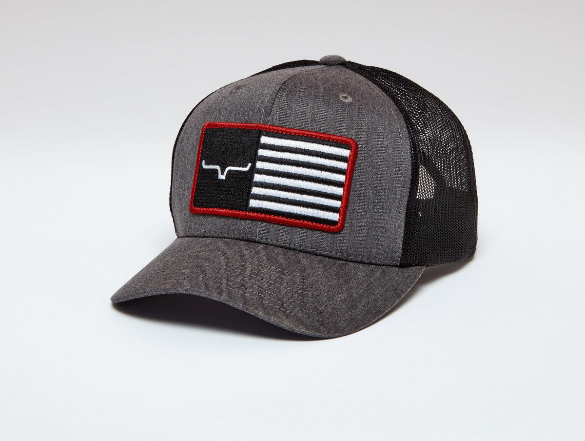 Kimes Ranch American Trucker Hat in Charcoal Heather with a red bordered flag patch featuring the Kimes Ranch logo