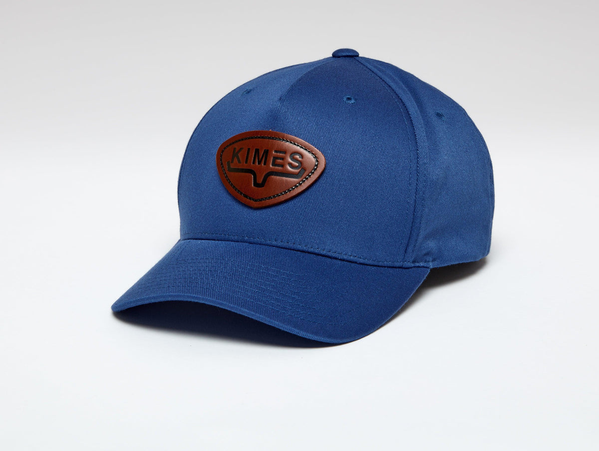 Kimes Ranch Fender Hat in Carbon Blue, side view, with a brown logo patch on the front