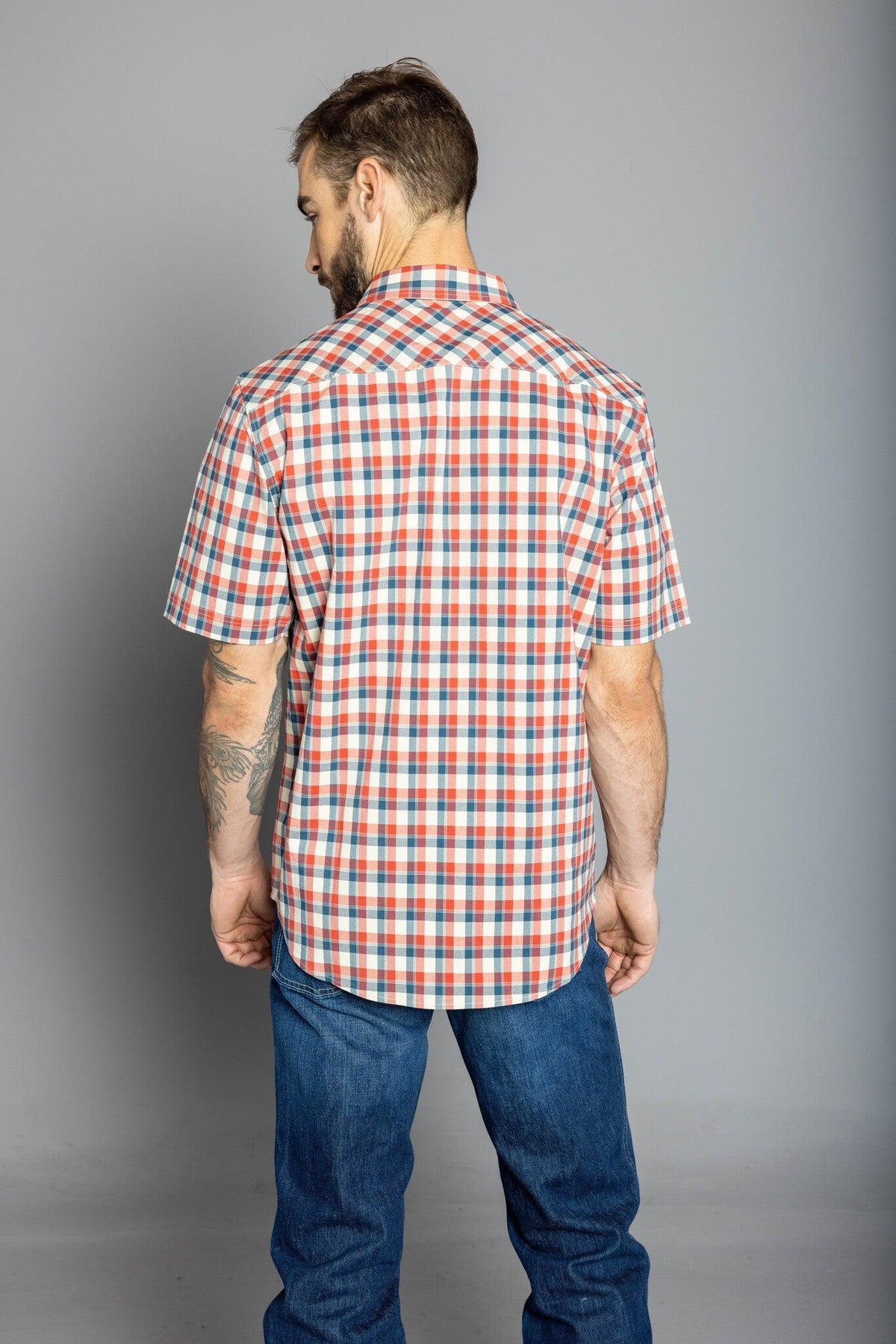 Kimes Ranch Go Round Plaid Dress Shirt in Navy, back view, with short sleeves and a plaid pattern
