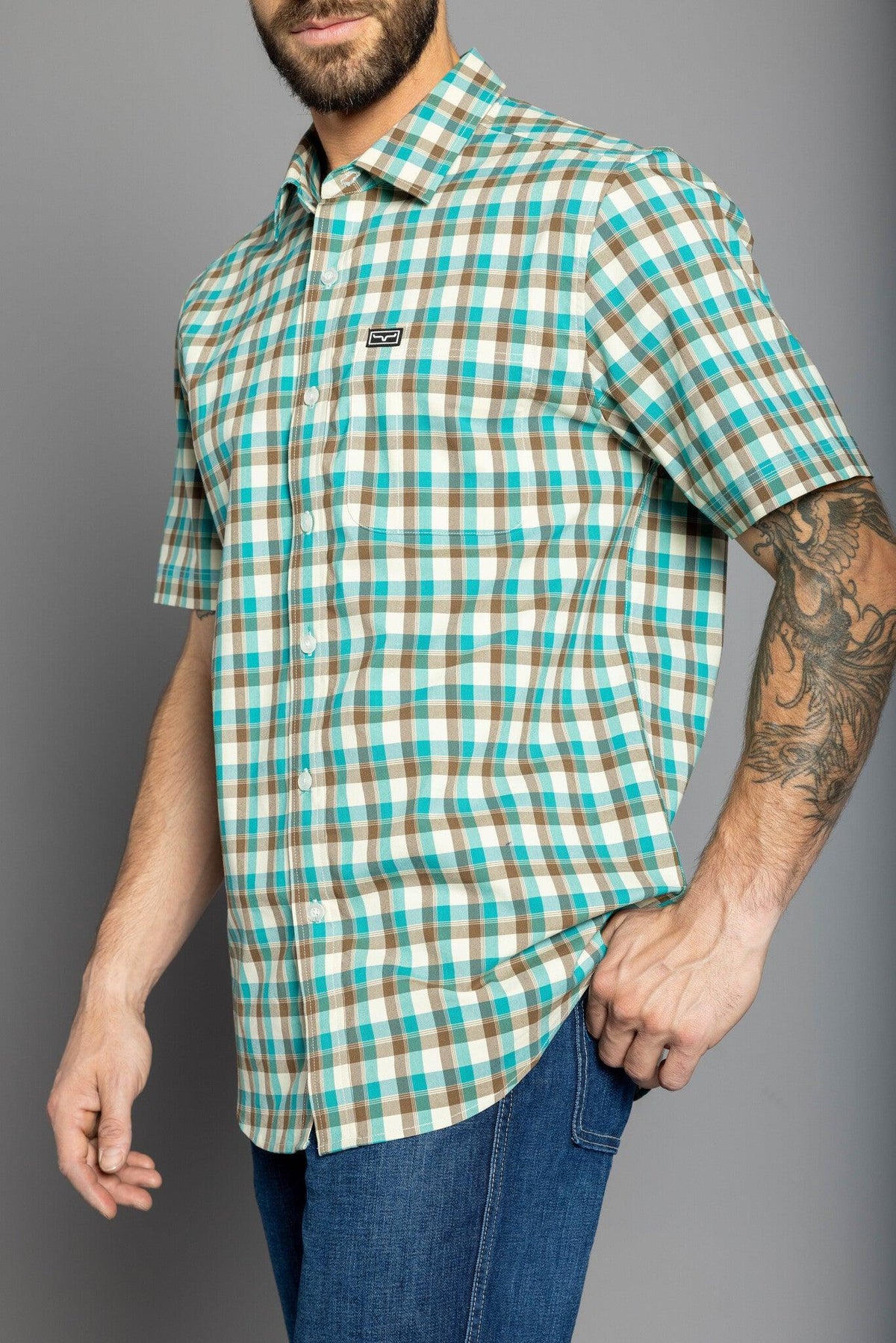 Kimes Ranch Go Round Plaid Dress Shirt in Teal with short sleeves and a chest pocket