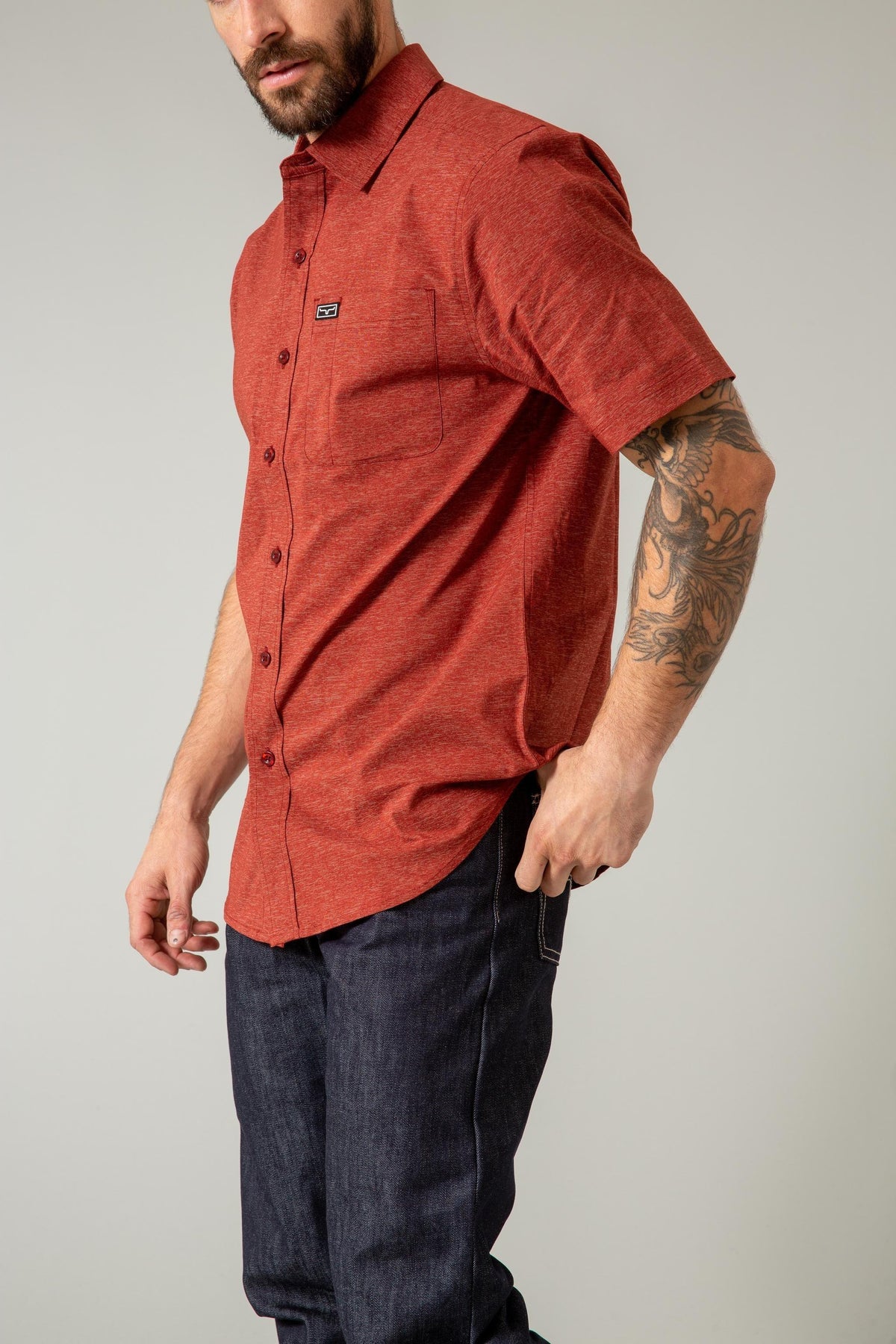 Kimes Ranch Linville Short Sleeve Dress Shirt in Dark Red, side view, with a chest pocket and logo patch