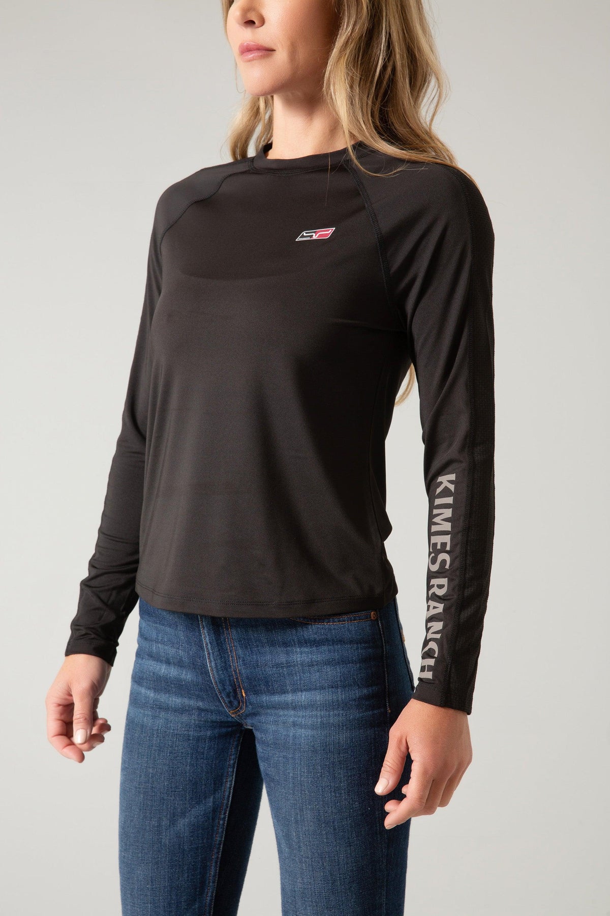Kimes Ranch K1 Ls Tech Tee Shirt in Black, side view, with a small chest logo and KIMES RANCH text down the sleeve
