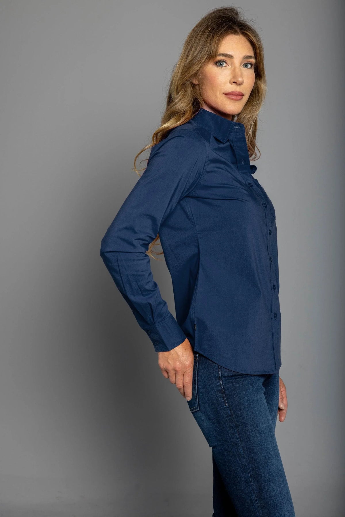 Kimes Ranch Ladies KR Team Shirt (Long) in Navy, side view, with a button front and long sleeves